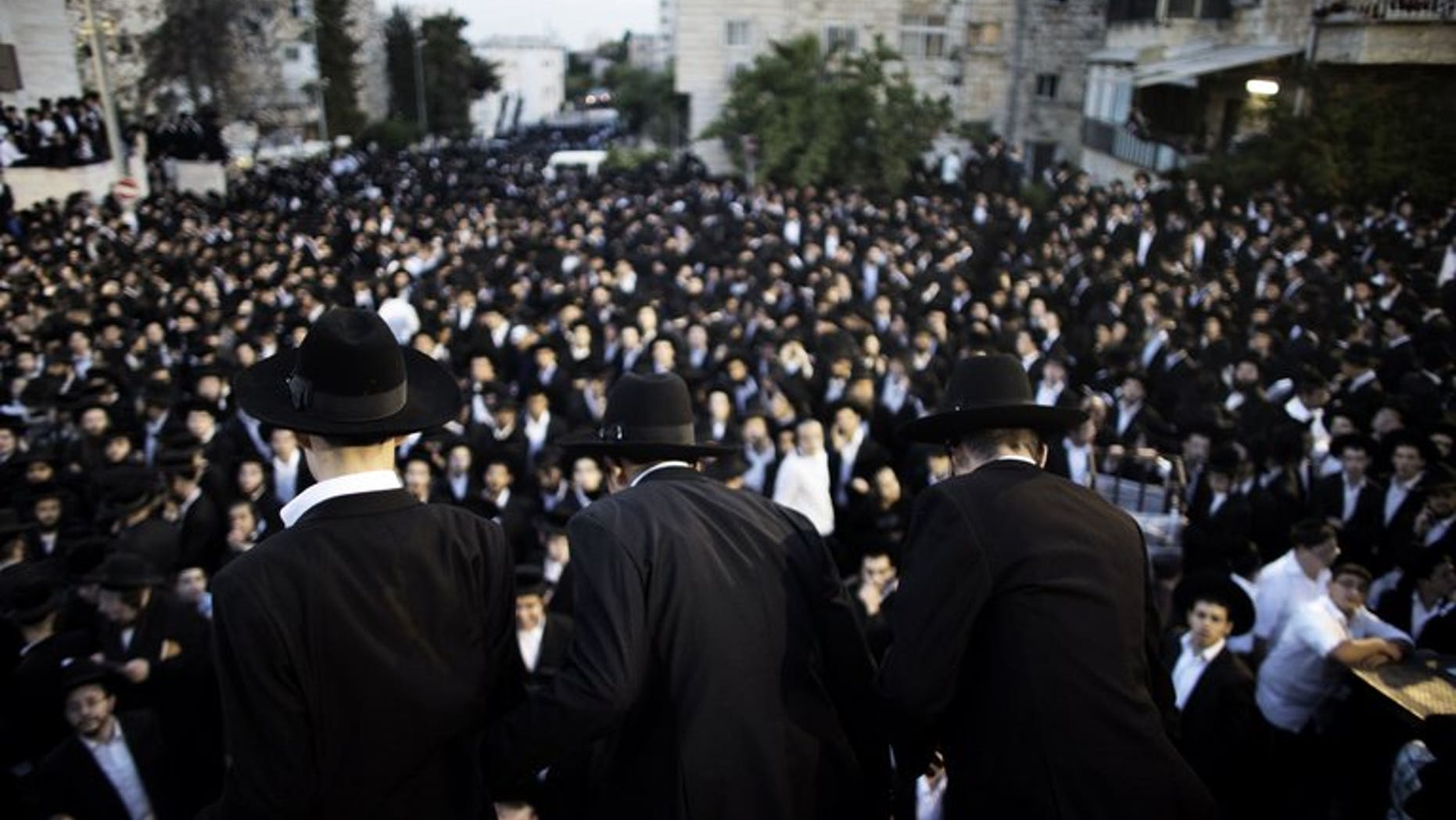 Thousands of ultra-Orthodox Jews gather in front of the main army recruitment office in Jerusalem on May 16, 2013 to demonstrate against any plans to make them undergo military service. The Israeli government on Sunday approved a draft law which will spell the end of a system which has seen tens of thousands of ultra-Orthodox exempt from military service.