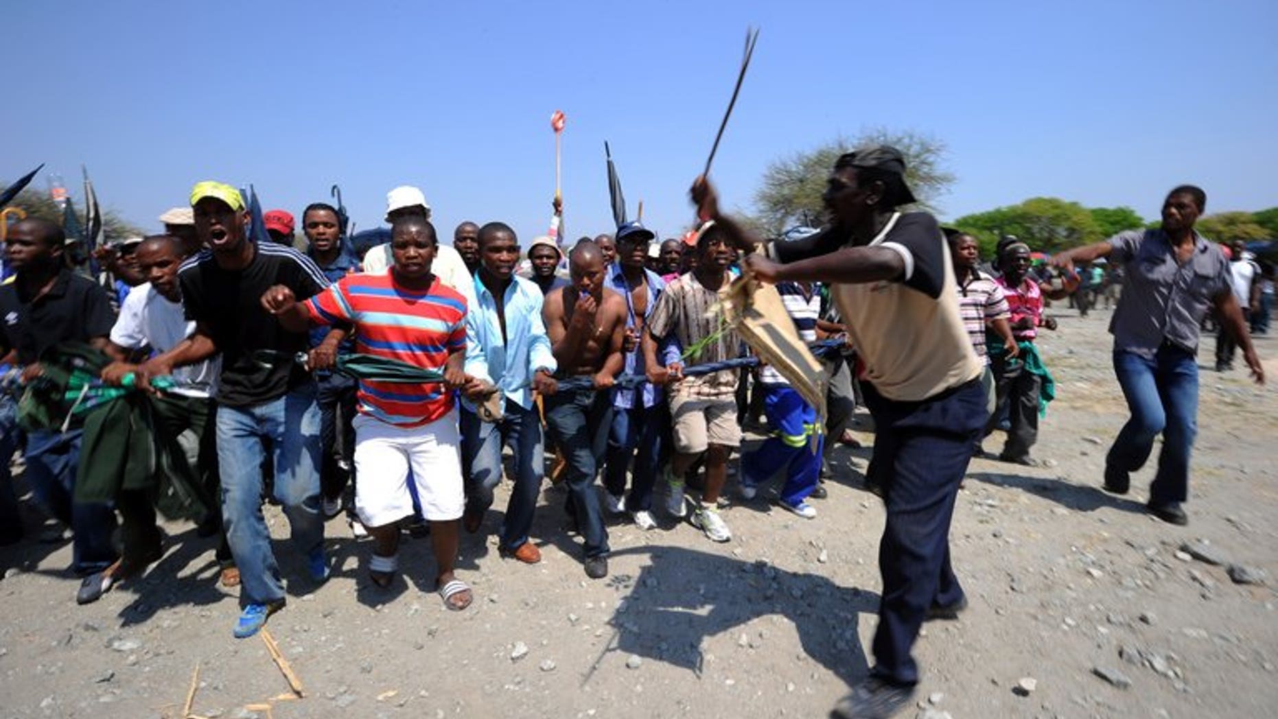 Some of 12,000 miners sacked by Amplats last year protest at Bleskop Stadium in Rustenburg last October. Some 5,600 mineworkers at the world's top platinum producer Anglo American Platinum downed tools overnight at the firm's South African operations, demanding the reinstatement of suspended union leaders, the company said Monday.