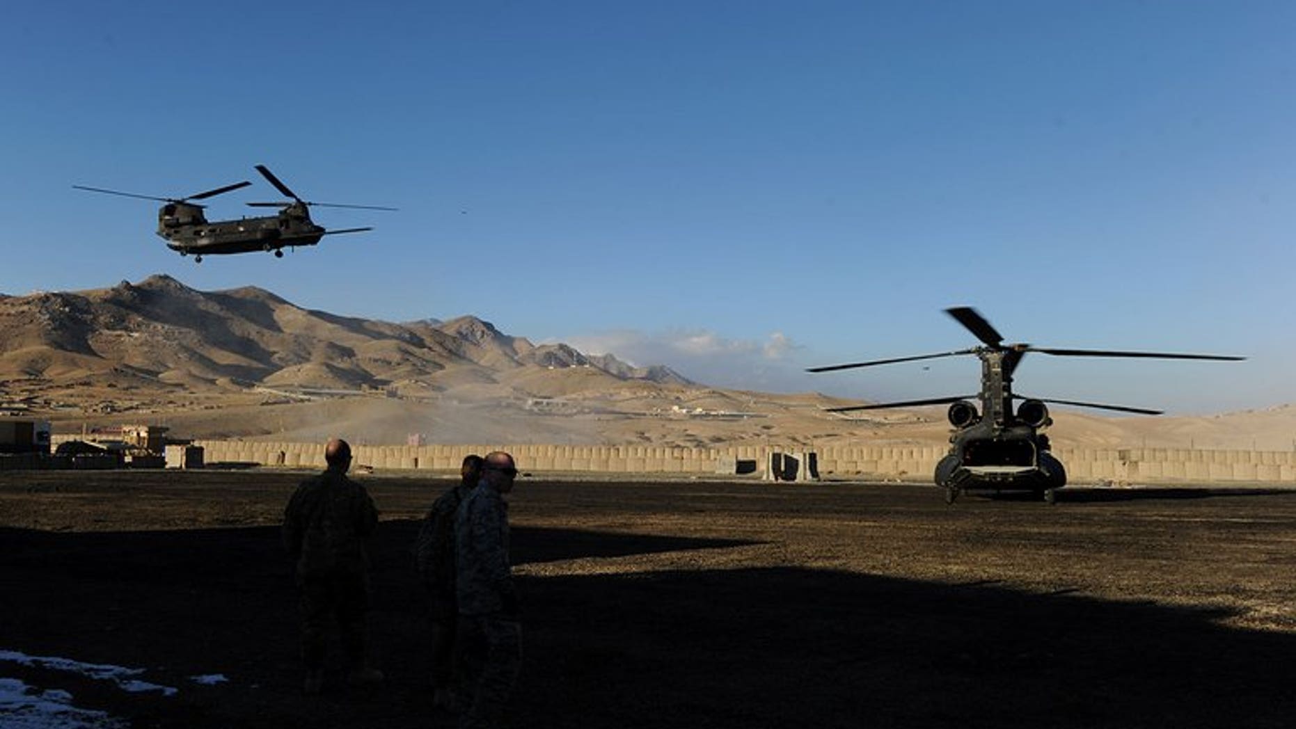 A US military helicopter prepares to land at a US base in Maidan Shar Wardak province on January 11, 2011. Afghanistan's intelligence agency is holding an Afghan-American translator on suspicion of torturing and killing civilians while working for US special forces, officials said Monday