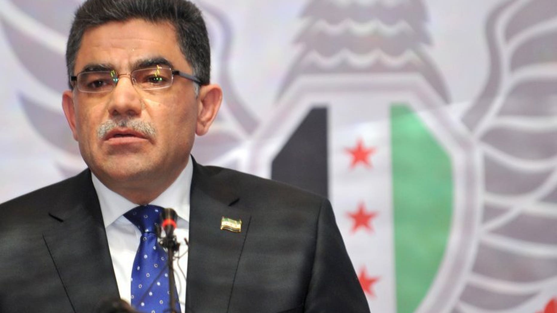 Ghassan Hitto, the newly-elected Prime Minister of Syria's main opposition National Coalition, speaks at an opposition meeting in Istanbul on March 19, 2013. Hitto announced his resignation on Monday, nearly four months after his appointment and having failed to form a government.
