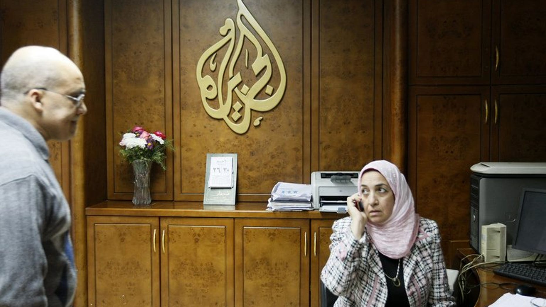 Al-Jazeera employees work at the pan-Arab television channel's bureau in Cairo on January 30, 2011. Several Al-Jazeera employees in Egypt have resigned because they disagreed with their employer's editorial line, an official at the Qatari television told AFP on Monday.