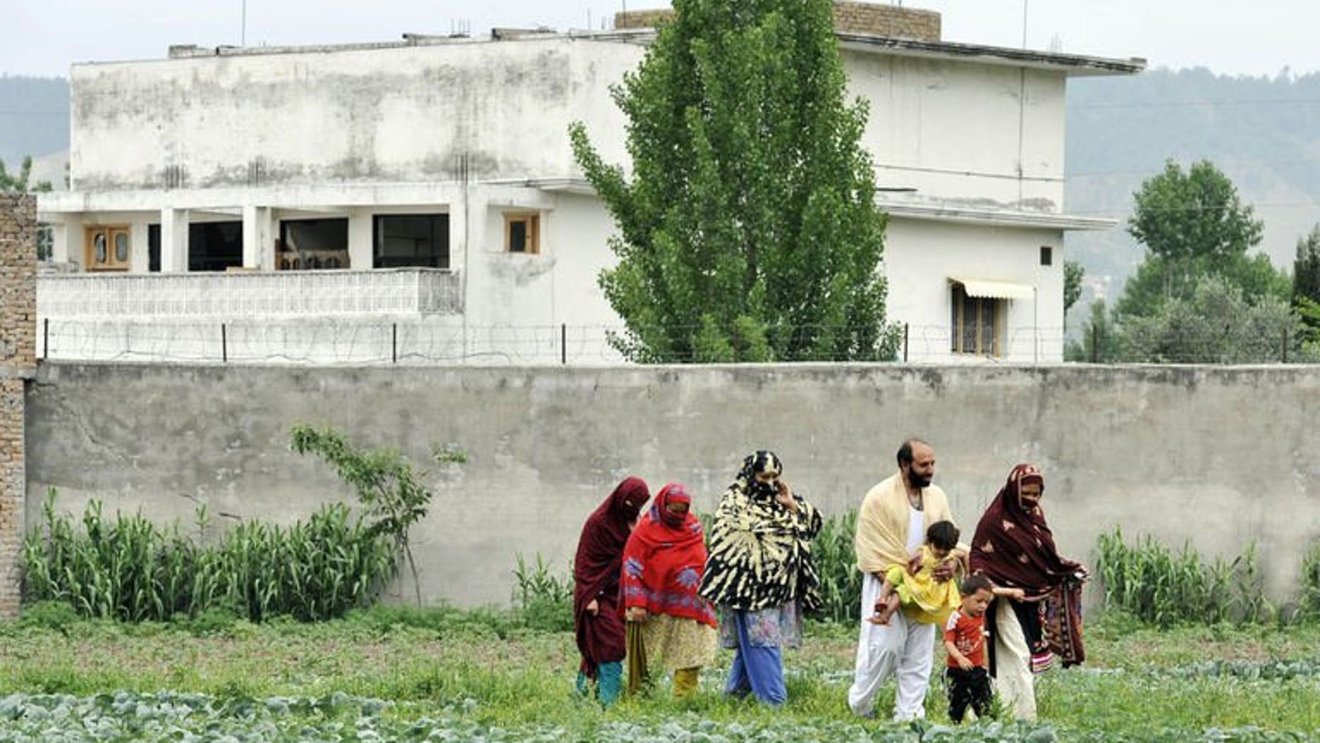 A Pakistani family leaves after visiting the hideout house of slain Al-Qaeda leader Osama bin Laden in Abbottabad on May 5, 2011. Pakistani collective failures, incompetency and negligence allowed Al-Qaeda leader Osama bin Laden to live in the country undetected for more than nine years, a leaked report has revealed Monday.