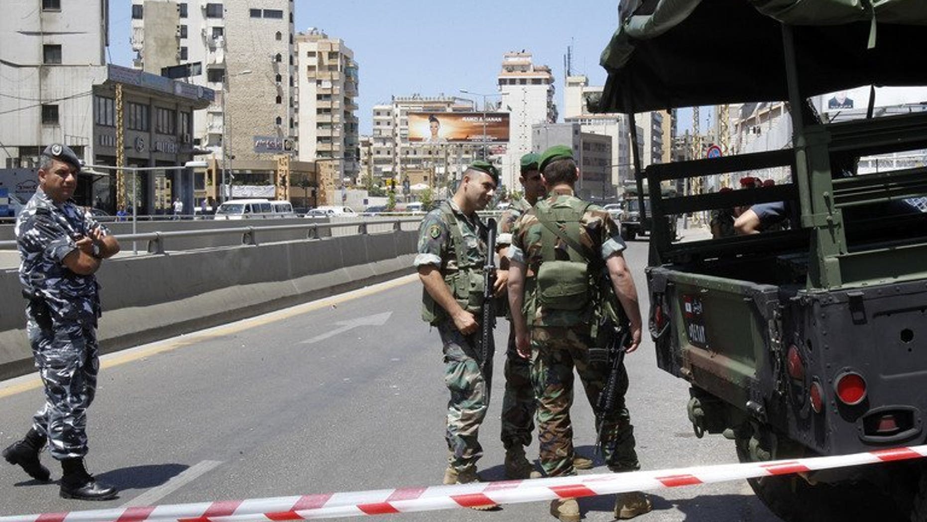 Lebanese security forces stand guard in Beirut on May 26, 2013. A car bomb on Tuesday rocked Beirut's Hezbollah stronghold in the southern suburbs, which is populated mainly by Shiite Muslims.