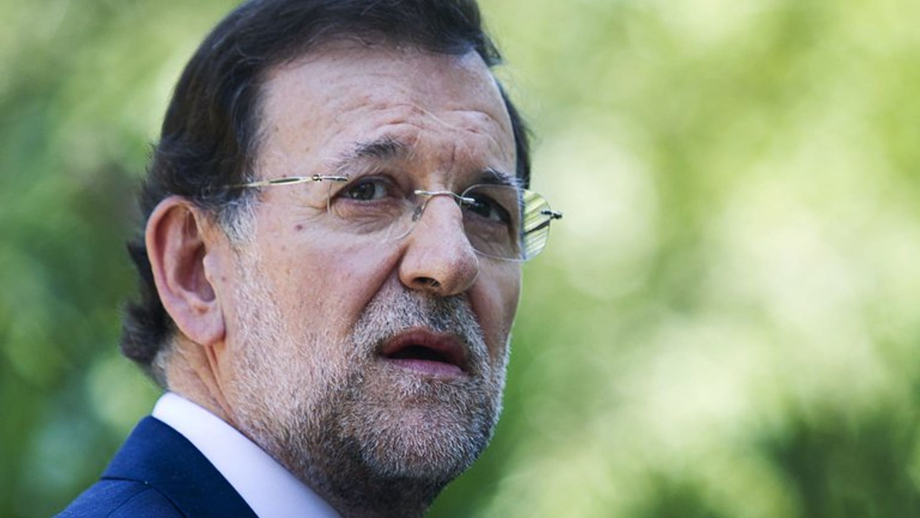 Spain's Prime Minister Mariano Rajoy gives a press conference in Mallorca, on August 14, 2012. A leading Spanish newspaper has published a page from what it said were original, hand-written ledgers implicating Rajoy in a slush fund scandal before he came to power.