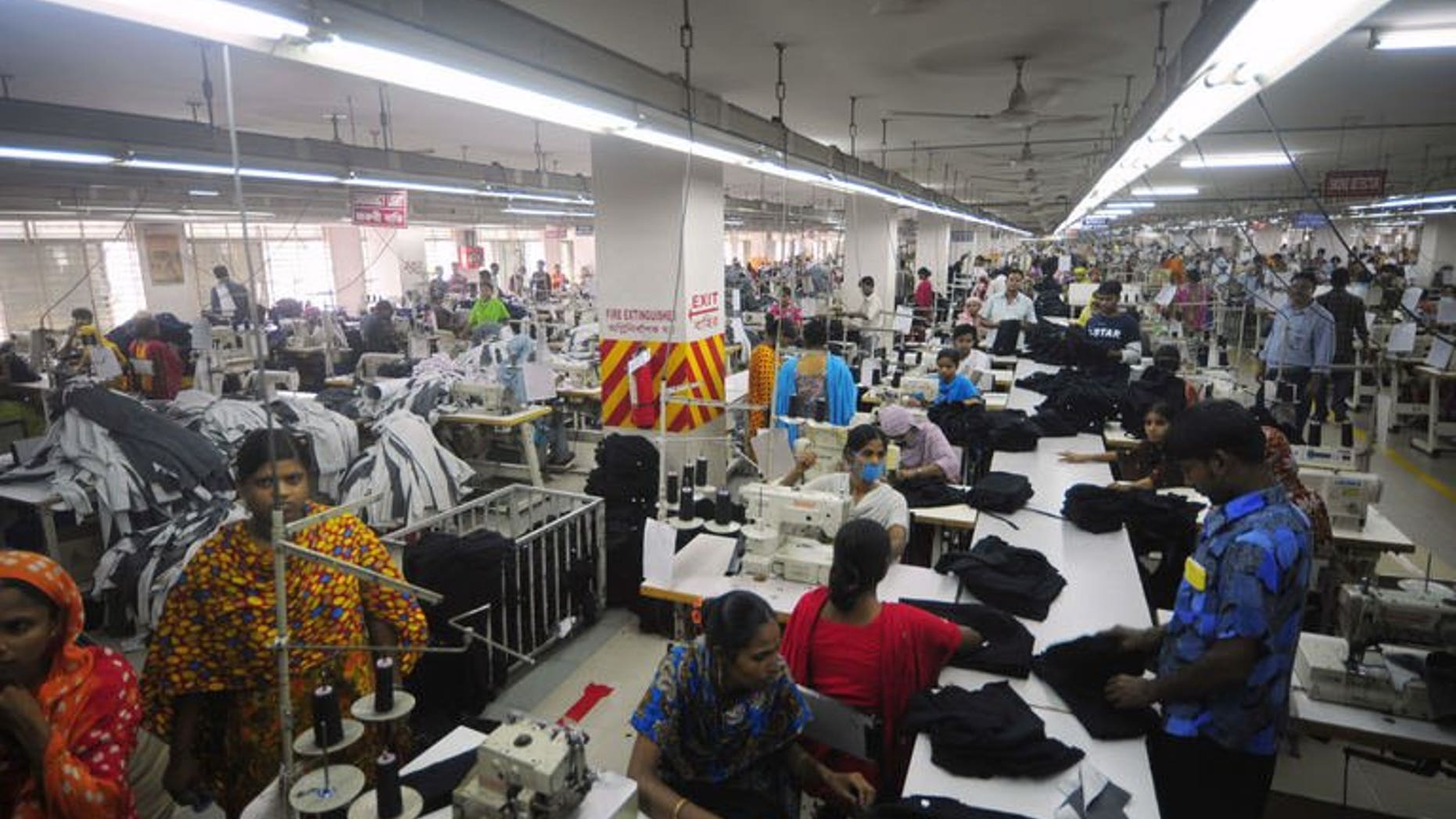 In this photograph taken on June 23, 2010, Bangladeshi women sew clothes in a garment factory in Ashulia. Output from Bangladesh's accident-prone garment sector has increased in June, with demand from foreign retailers still growing despite the country's factory disaster in April.