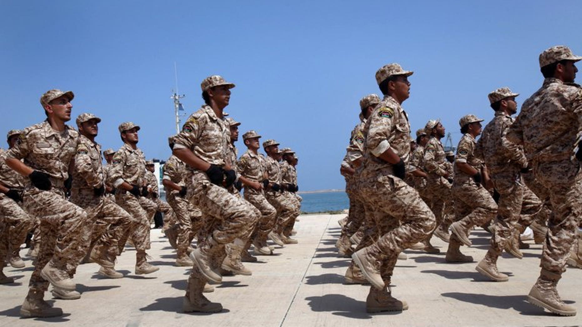 Libyan soldiers march during their graduation ceremony in Tripoli, on July 3, 2012. Britain is to train up to 2,000 Libyan troops in a bid to "help them achieve peace and stability across their country", the British defence ministry announced