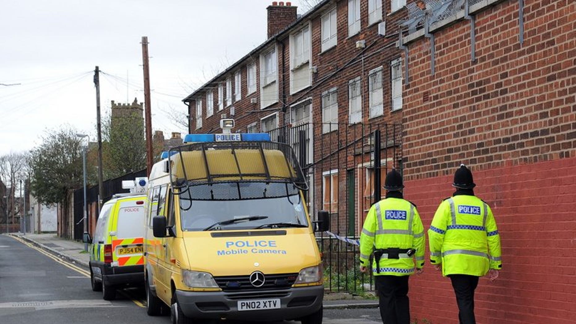 Police officers patrol in Liverpool, northwest England, on April 10, 2009. An British online "troll" who sparked a security alert in the United States by threatening on Facebook to kill 200 schoolchildren was jailed on Tuesday for two years and four months.