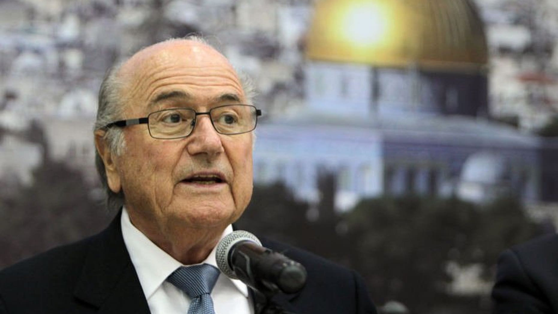 FIFA President Sepp Blatter speaks in the West Bank city of Ramallah on July 7, 2013. Blatter urged Israel on Tuesday to ease restrictions on the movement of Palestinian players and officials that have long dogged the development of football in the West Bank and Gaza Strip.