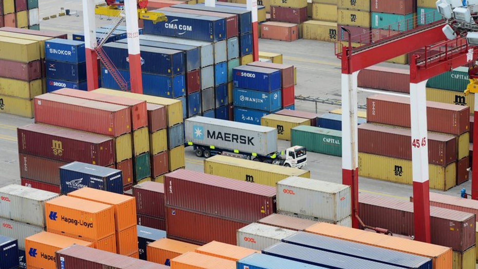 Shipping containers at port in Qingdao, east China, on May 8, 2013. China's monthly trade surplus fell 14.0 percent in June to $27.13 billion, government data showed, as imports and exports both declined.