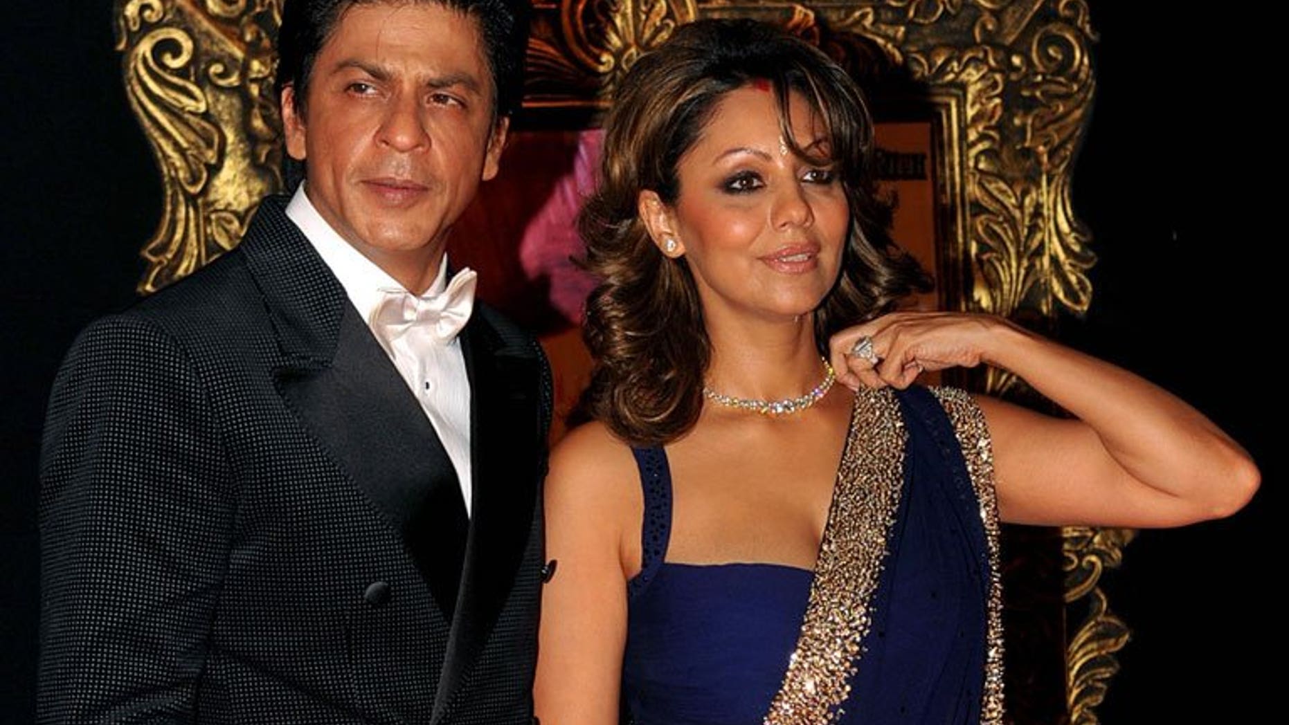 Bollywood star Shah Rukh Khan and his wife Gauri at the premiere of "Jab Tak Hai Jaan" in Mumbai on November 12, 2012. The couple have announced the arrival of their new baby boy born to a surrogate mother, and denied rumours of an illegal pre-natal gender test.