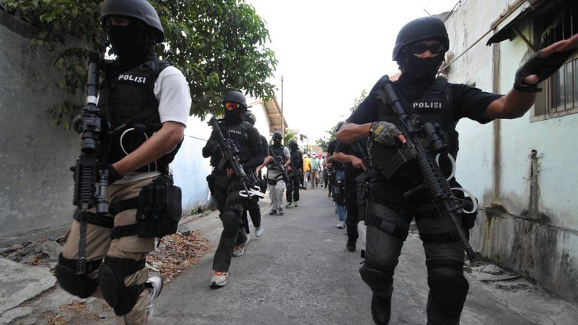 Indonesian anti-terror police from 'Detachment 88' raid a house in Solo, on September 26, 2012. Indonesia's most wanted Islamic militant has appeared in a video posted on the Internet delivering a tirade against 'Detachment 88' and urging "jihad".