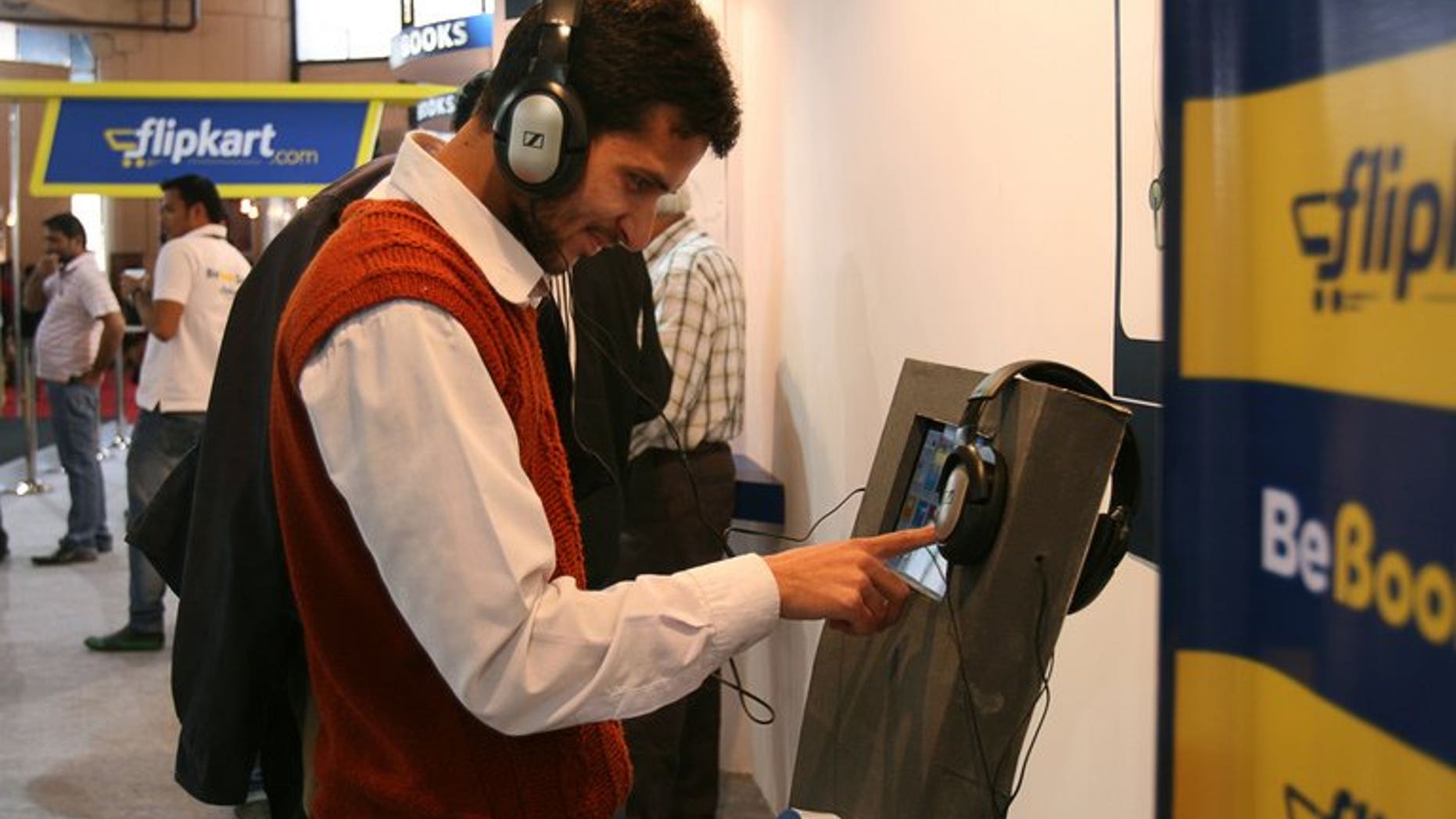 A visitor browses through books of Indian online book retailer Flipkart on a screen at the New Delhi World Book Fair in New Delhi on February 25, 2012. India's top e-commerce company Flipkart said Wednesday it has raised $200 million from private investors in what it called the biggest one-time investment in an Indian online retail firm.