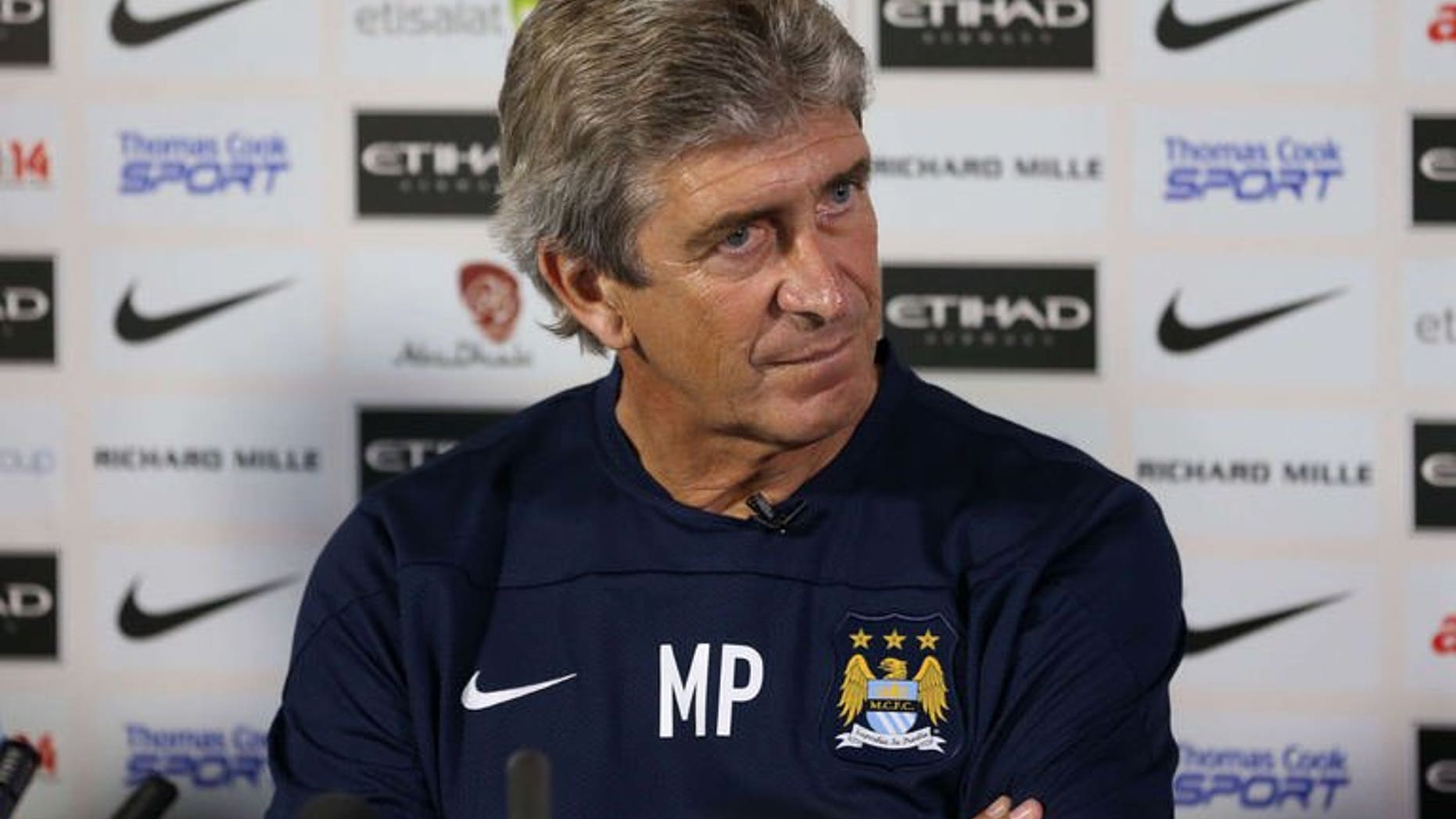 Manchester City's new Chilean manager Manuel Pellegrini attends a press conference at the team's Carrington Training Ground, in Carrington on July 10, 2013.