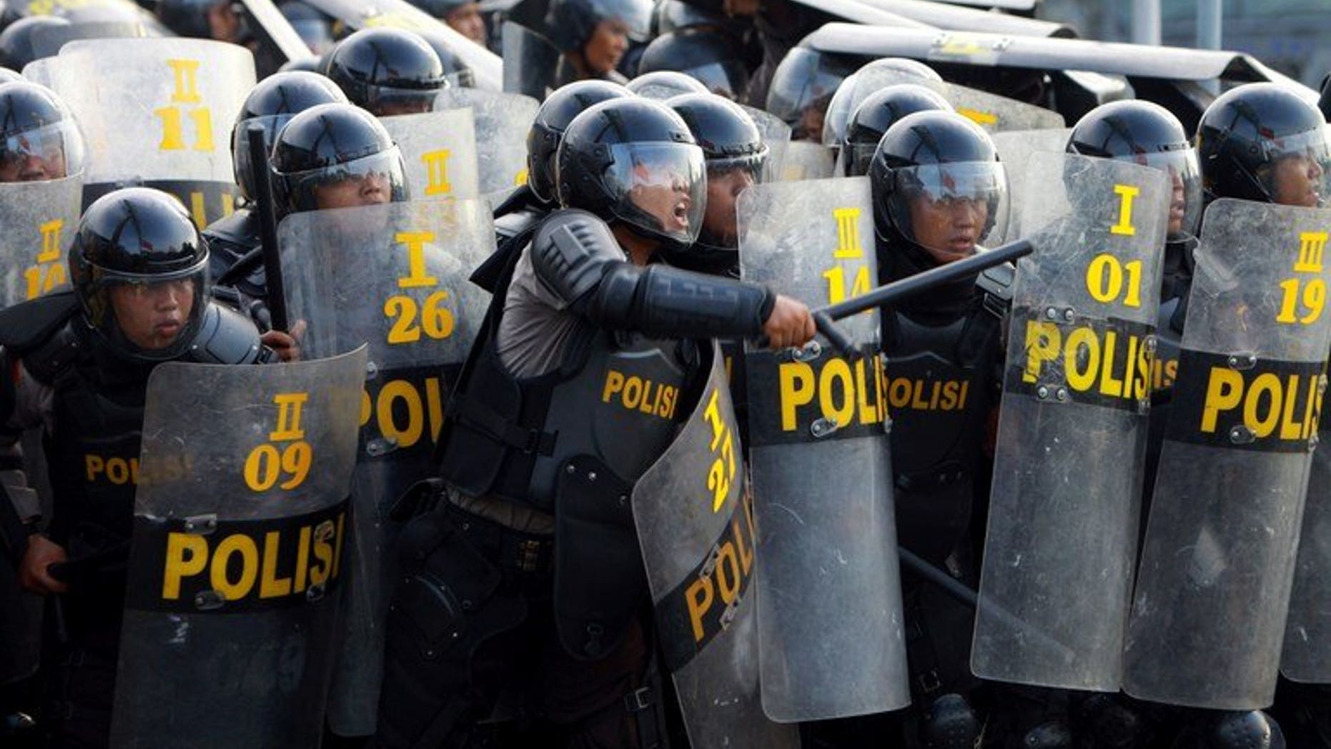 Indonesian police during a protest in Medan on March 26, 2012. Around 200 prisoners escaped from an Indonesian jail Thursday after violent riots erupted, with inmates setting fire to the prison and hurling bottles at guards.