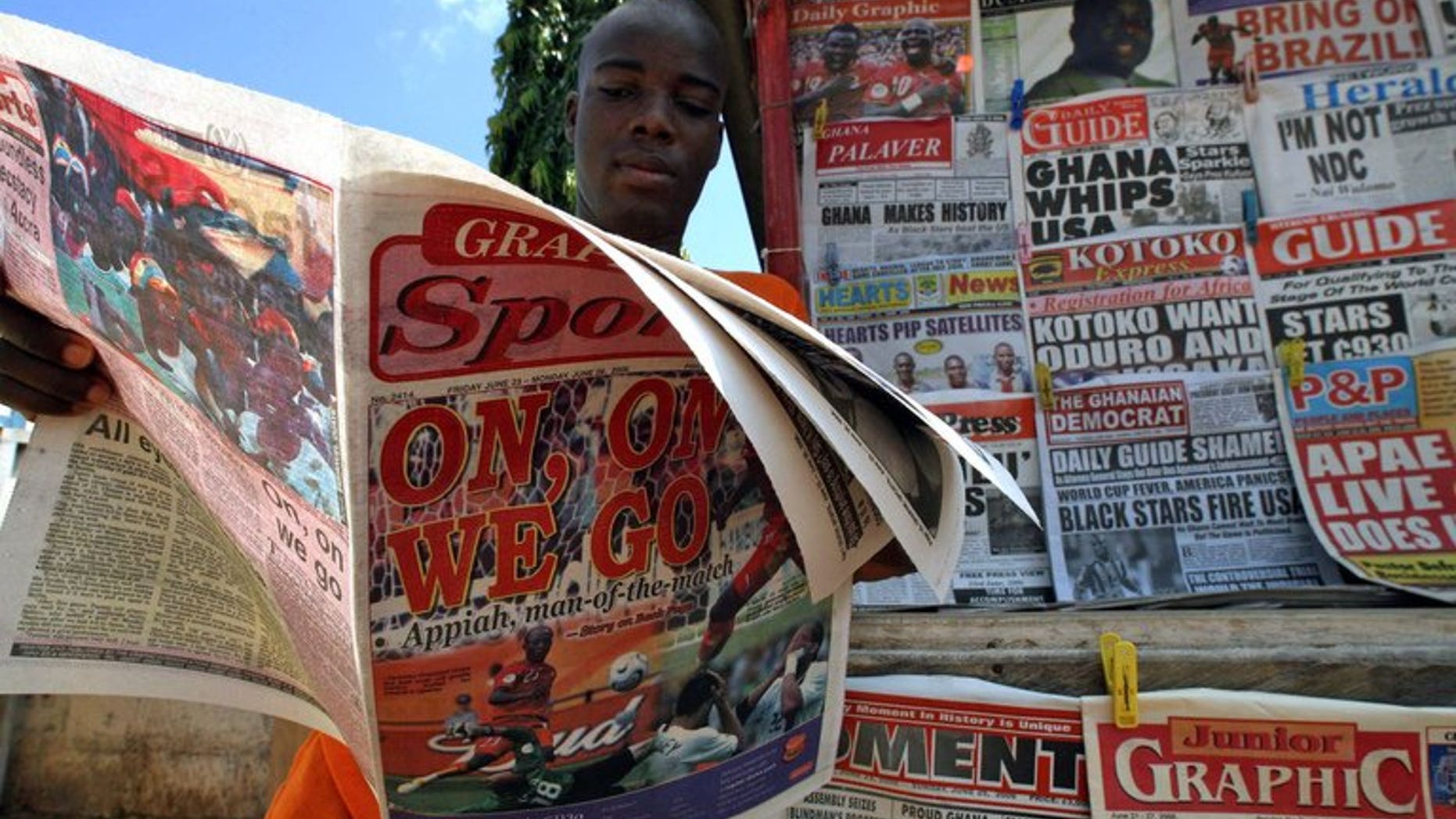 A man reads a newspaper on June 23, 2006 in Accra. A Ghanaian newspaper editor was released Thursday after serving a controversial 10-day jail term ordered by the west African nation's supreme court for criticising the judges' handling of a dispute over last year's presidential election.
