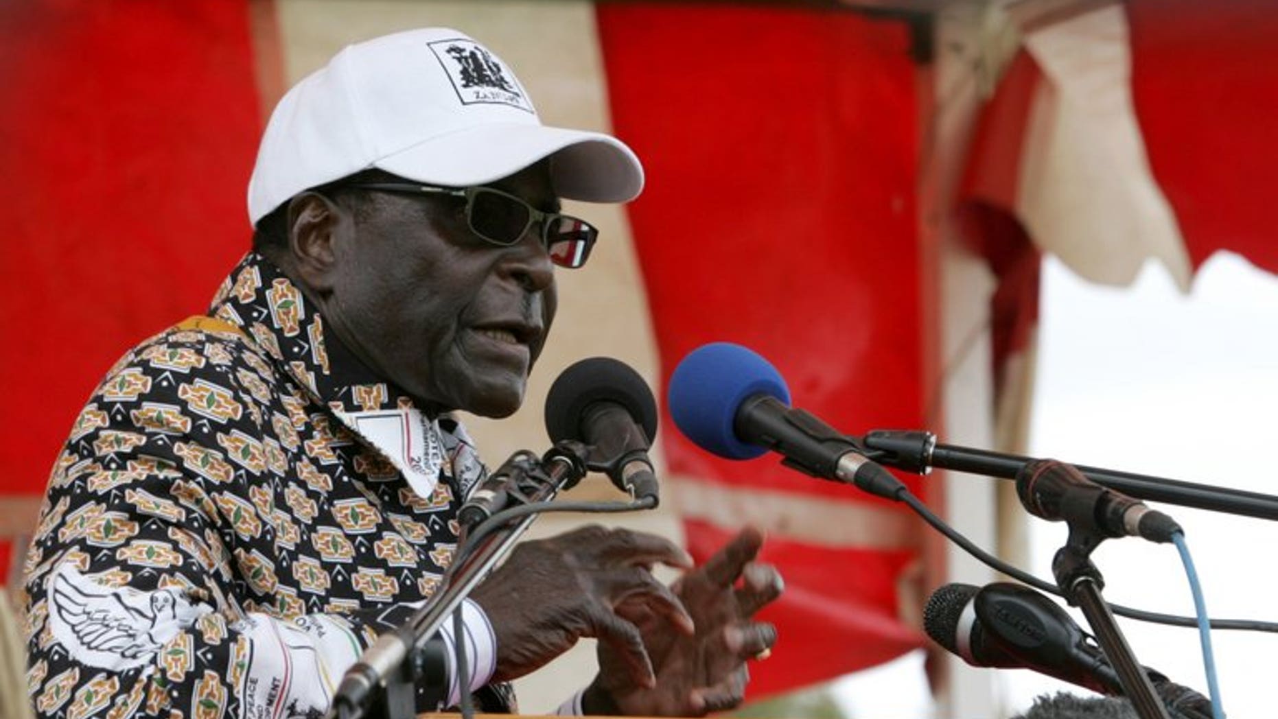 Zimbabwe President Robert Mugabe addresses an election rally in Mashonaland Central province on July 11 2013. Global rights watchdog Amnesty International has called on African blocs to ensure that Zimbabwe's upcoming elections are not marred by violence similar to the 2008 vote.