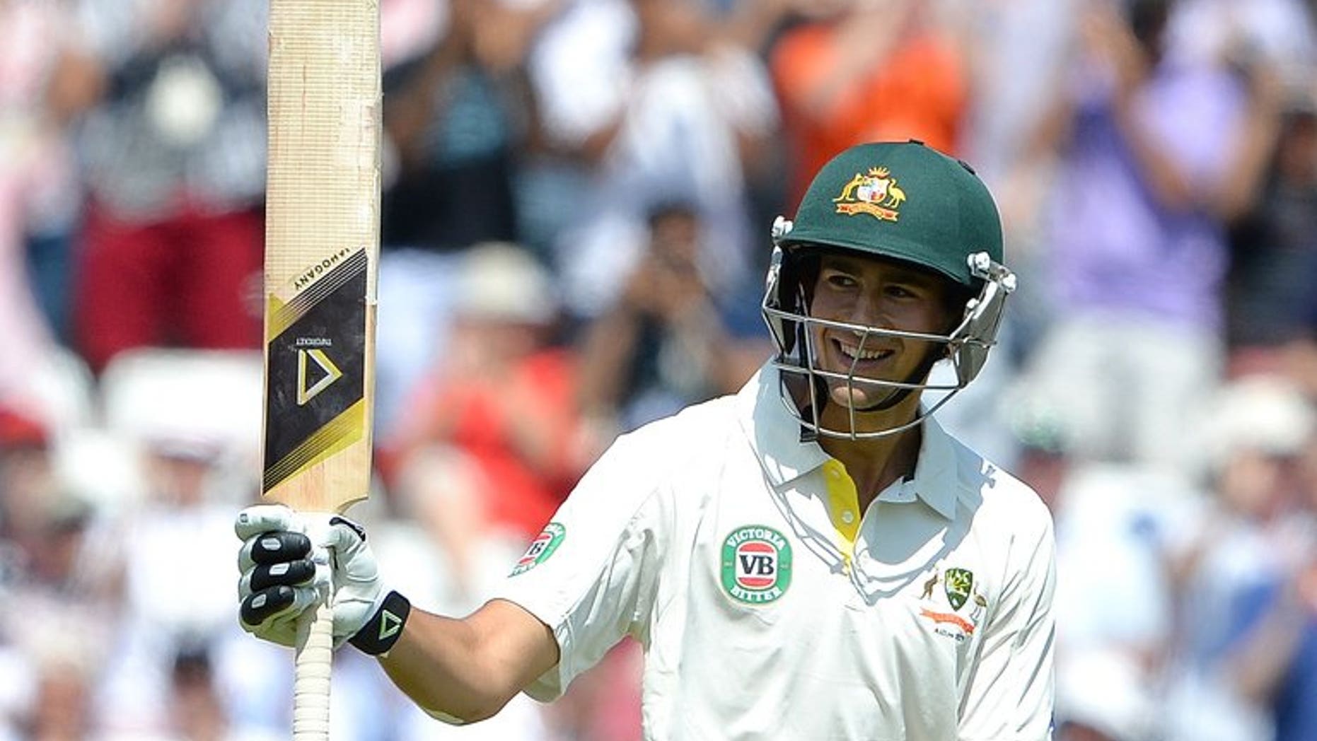 Australia's Ashton Agar celebrates his half-century during the first Ashes Test on July 11, 2013. Agar was acclaimed a national sporting hero by Australia's press after the youngster's record-breaking 98 on debut that has turned the opening Test against England.