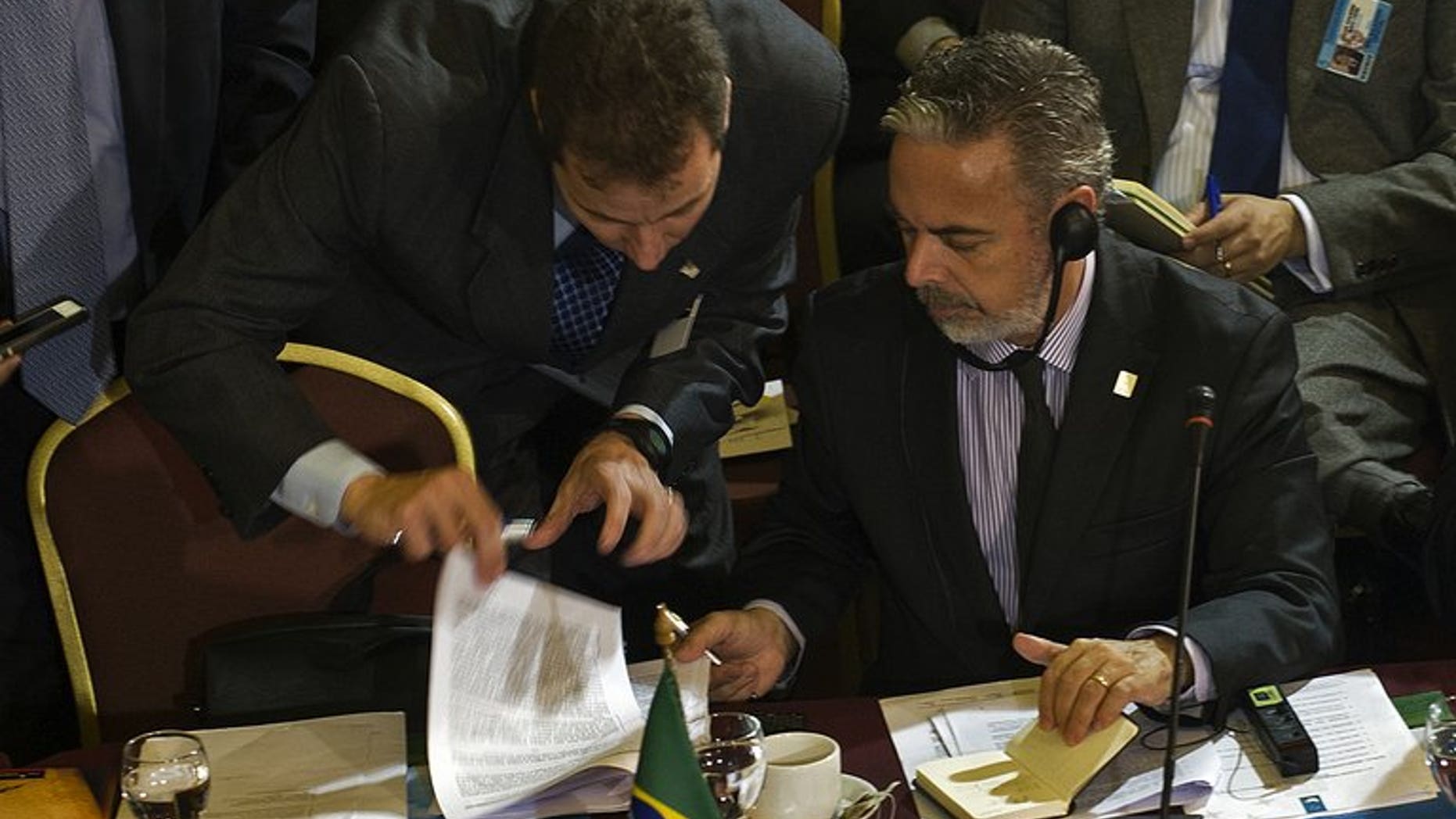 Brazil's Foreign Minister Antonio Patritota listens to an assistant during a Mercosur meeting in Montevideo on July 11, 2013. Leaders of the South American trade bloc that includes Brazil and Venezuela meet Friday for a summit that will focus on allegations of US spying that have outraged US allies and rivals alike.