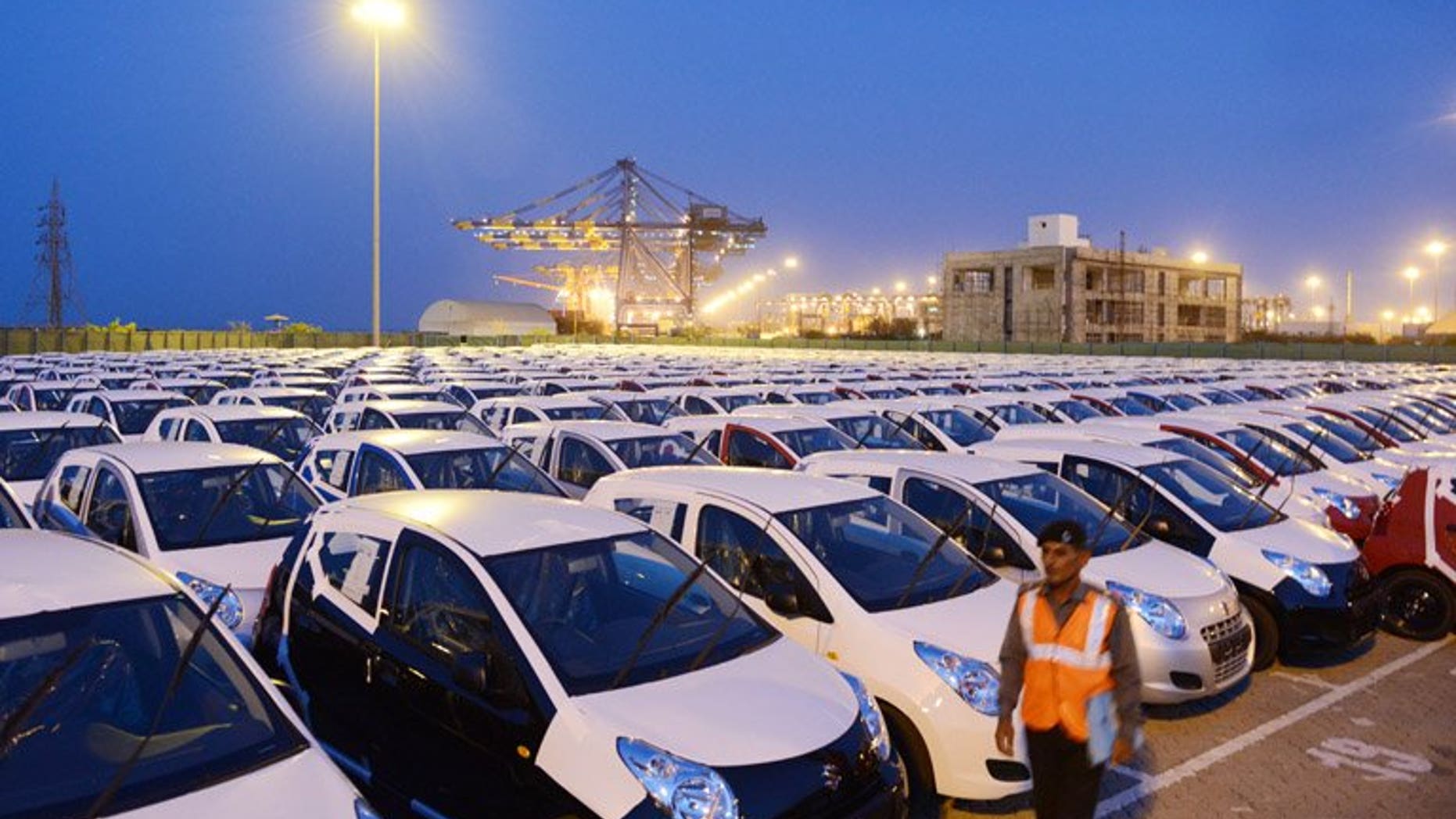 Maruti Suzuki Alto for export are parked in a holding area in Mundra last month. India's car sales slid nine percent in June, marking a record eighth straight month of decline, data showed Friday, as the industry demanded a government package to revive the once booming sector.