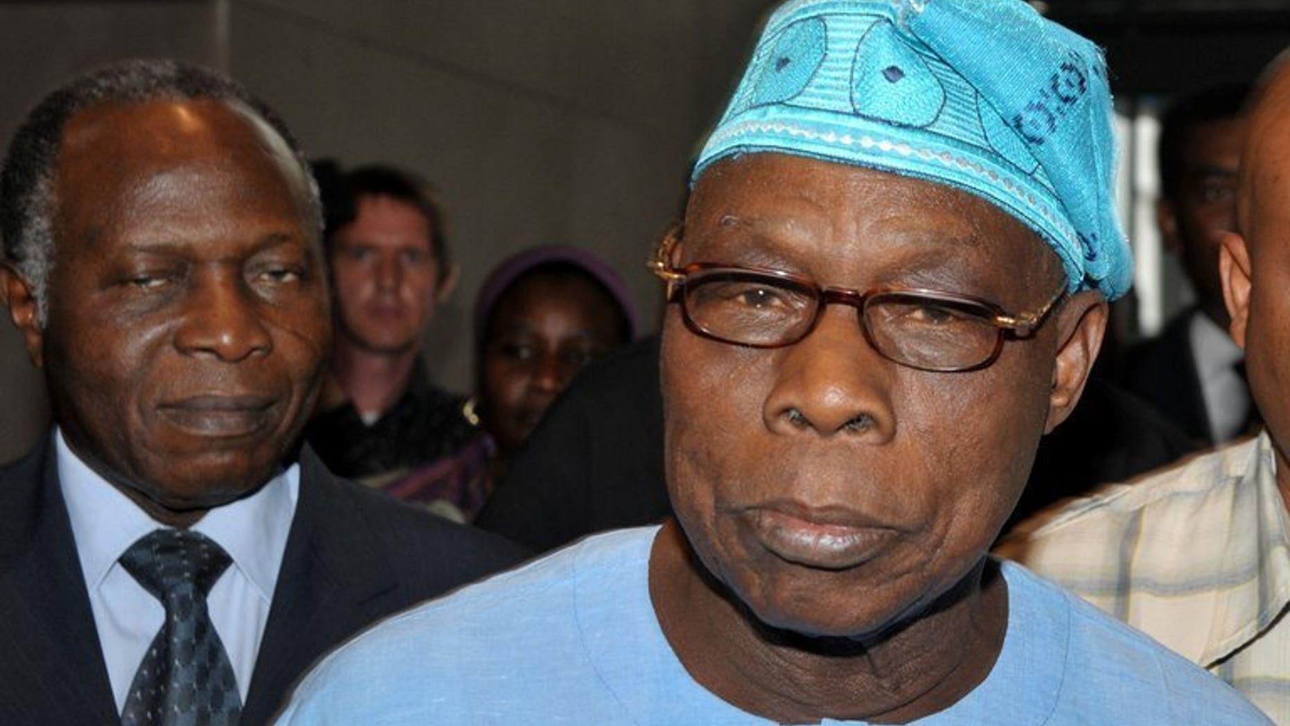 Former Nigerian president and head of a joint mission launched by the African Union (AU) and the Economic Community of West African States (ECOWAS) Olusegun Obasanjo (R) pictured in Dakar on Feburary 25, 2012. Obasanjo will lead a team of 60 African Union monitors to Zimbabwe for the July 31 election, the organisation said Friday.