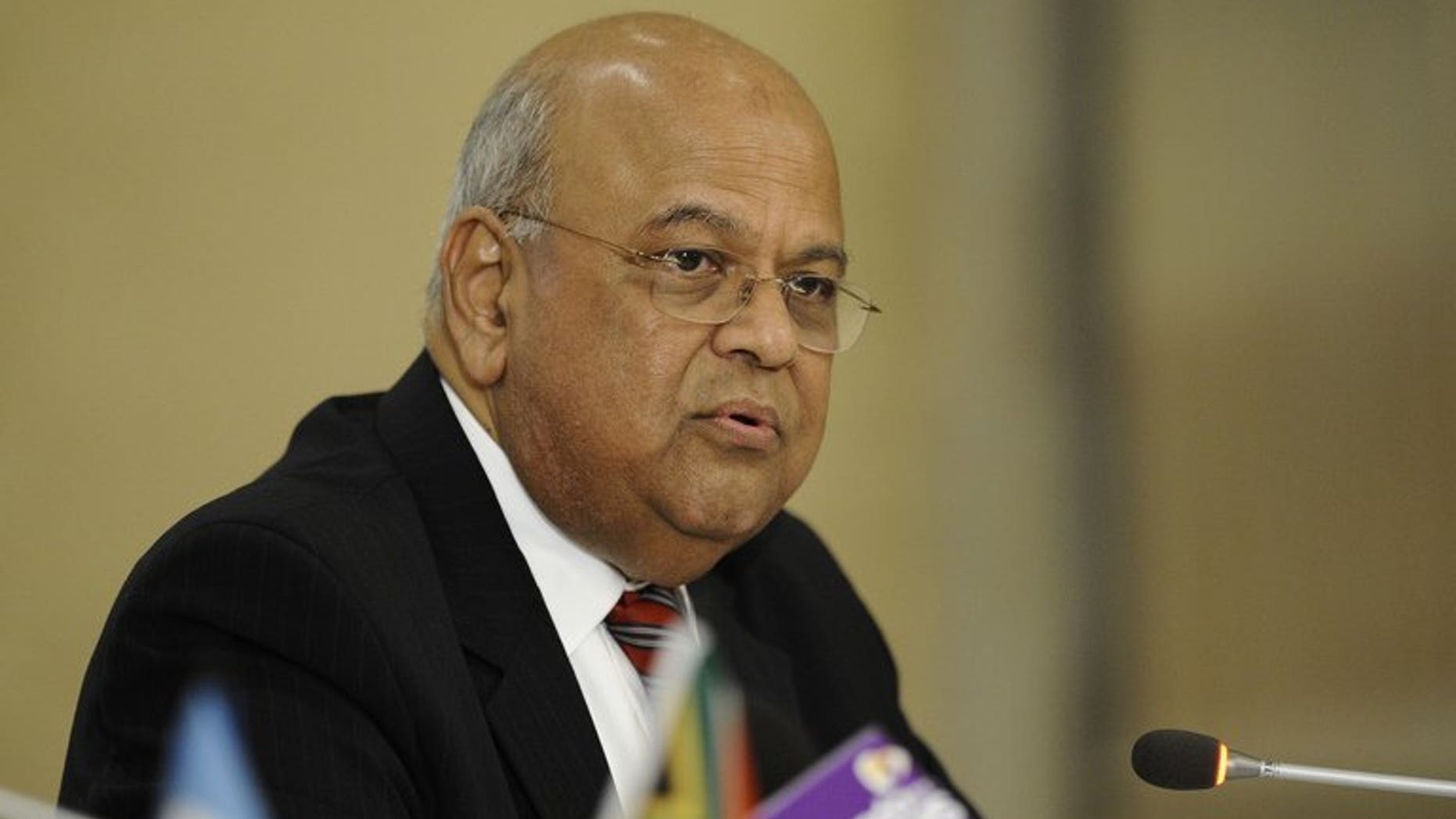 South African Finance Minister Pravin Gordhan speaks during a joint press conference with World Bank newly-appointed President on September 6, 2012 in Pretoria. South Africa's top tax official has resigned following an investigation into allegations of impropriety, Gordhan announced Friday.