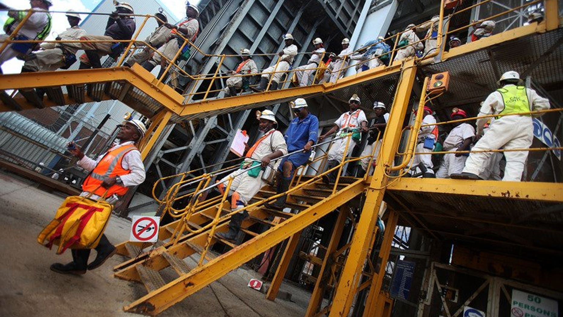 Mine workers leave on January 19, 2011 the 14 Shaft of the Impala Platinum mine in Phokeng. Two of South Africa's leading mining companies on Friday named a hardline union as the largest grouping at some facilities, raising hopes for an end to months of labour unrest.