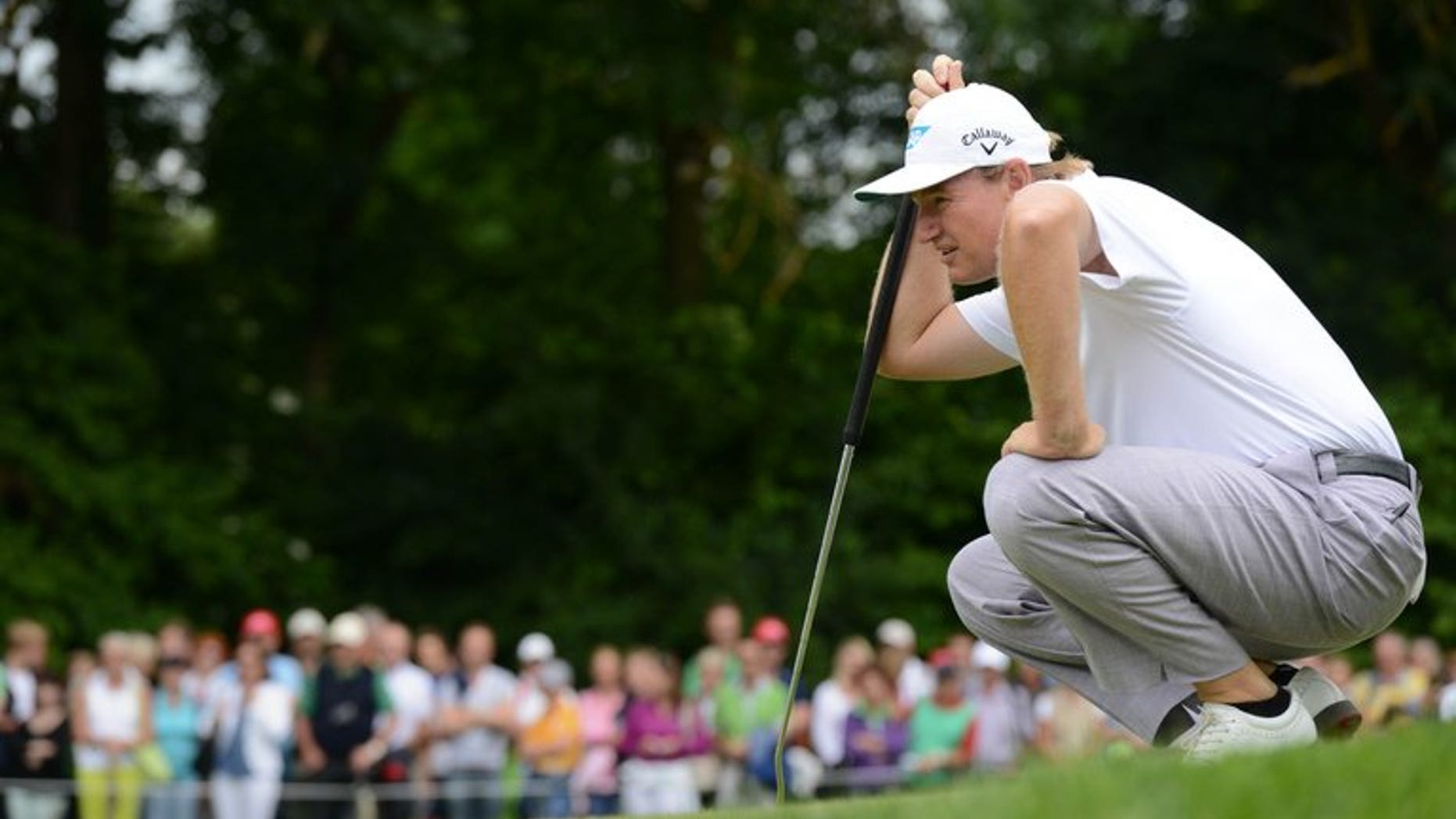 South Africa's Ernie Els watchs the ball at the Golfclub Eichenried near Munich, southern Germany, on June 23, 2013. Els headed a list of four former British Open champions missing the halfway cut at the Scottish Open at Castle Stuart on Friday.