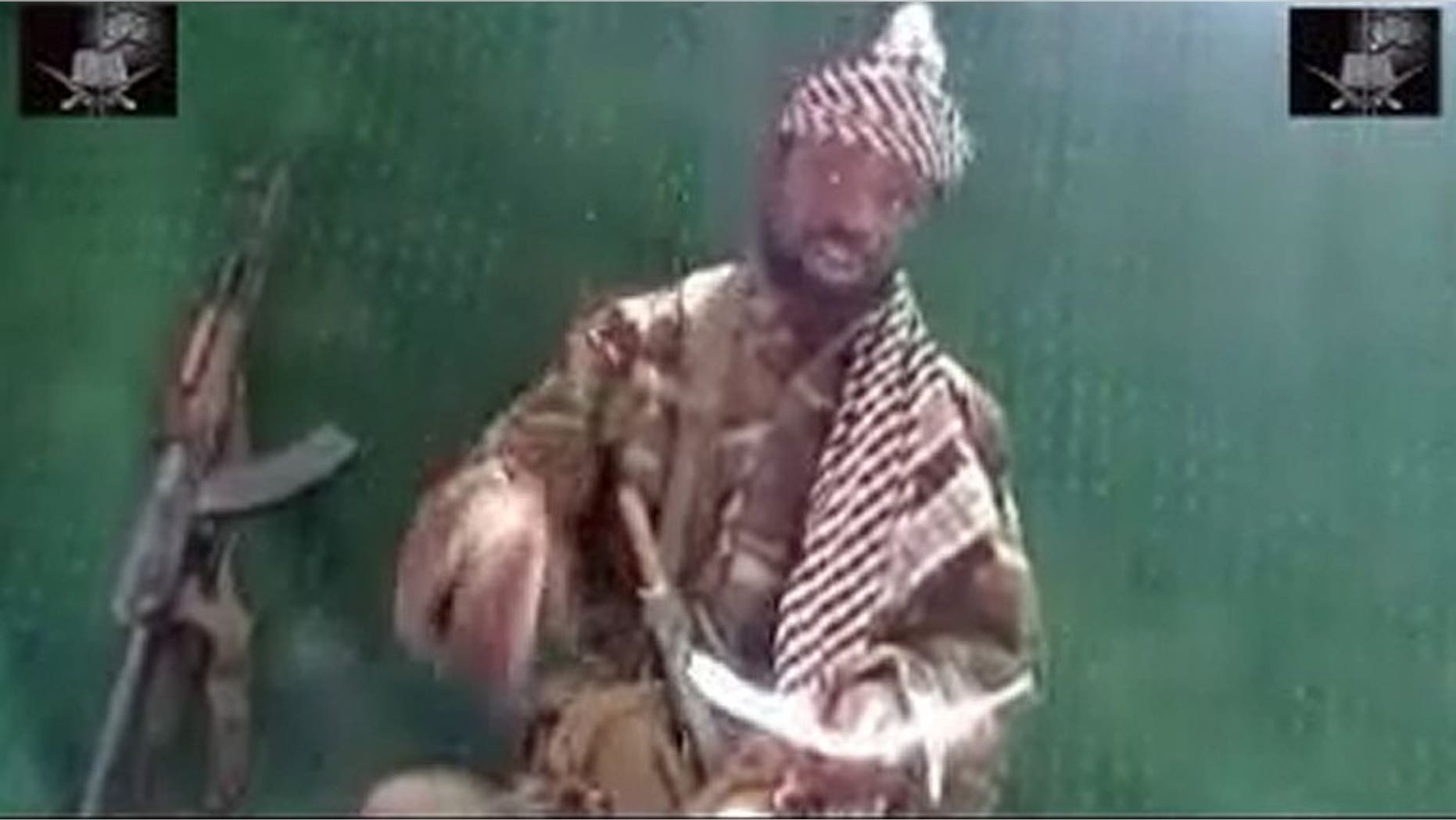 Picture taken May 29, 2013 from a video obtained by AFP shows the leader of the Islamist extremist group Boko Haram Abubakar Shekau. In a ten-minute video delivered to AFP Saturday, Shekau said he supported a July 6 attack on a school that killed 42 people, but did not claim responsibility for the massacre,