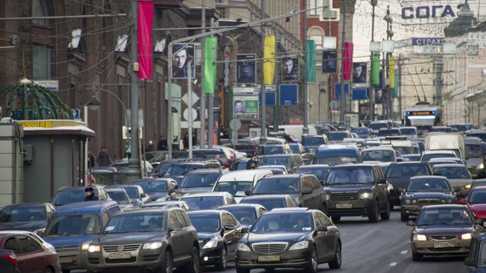 Cars are blocked in a traffic jam in the center of Moscow, on February 29, 2012. Russian police say at least 14 people have been killed and 16 injured in a traffic accident outside Moscow involving a truck, a passenger bus and several other vehicles.