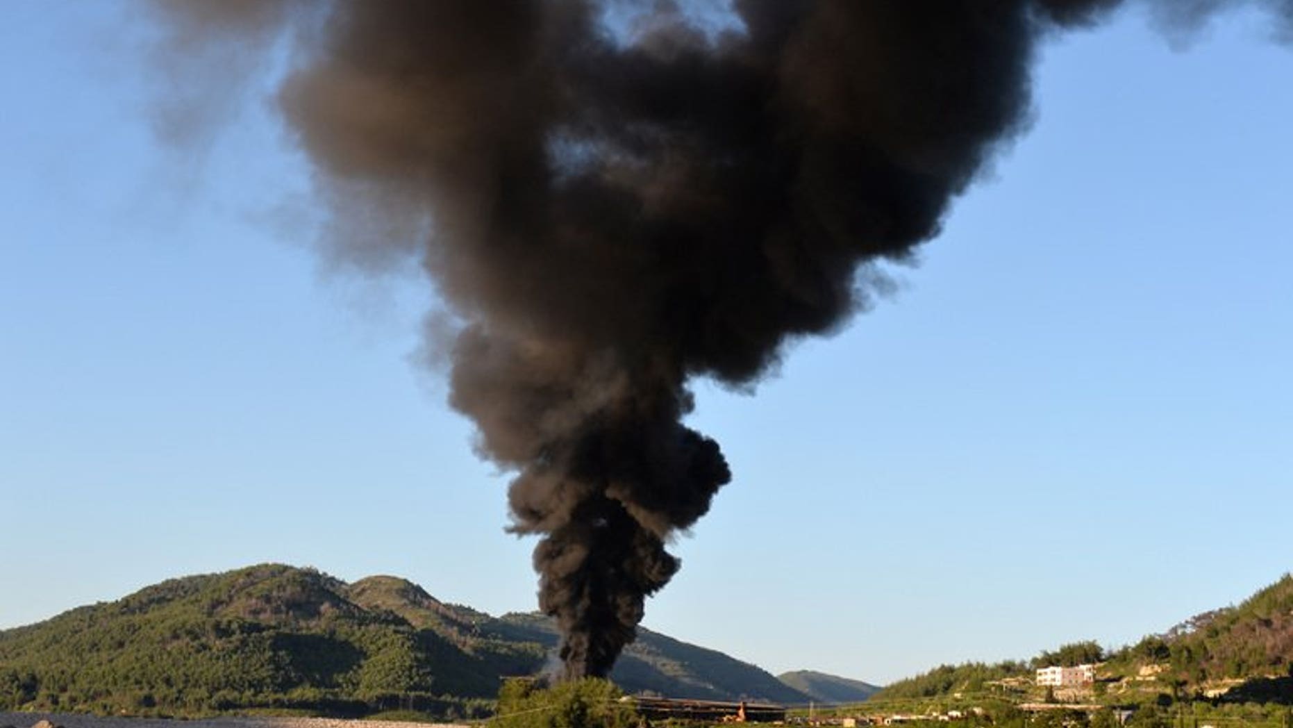 Smoke rises after shelling in Latakia province, western Syria, on April 25, 2013. The White House said that Syria had likely used chemical weapons against rebel forces on a "small scale," but emphasized US spy agencies were still not 100 percent sure of the assessment. AFP PHOTO / MIGUEL MEDINA