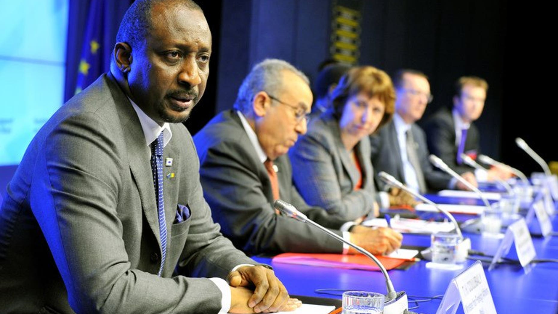 Malian Foreign minister Tieman Coulibaly (left), pictured on February 5, 2013 at the EU headquarters in Brussels, says the country will push ahead with a presidential vote this month and warned rebel groups in the north against opposing the election.
