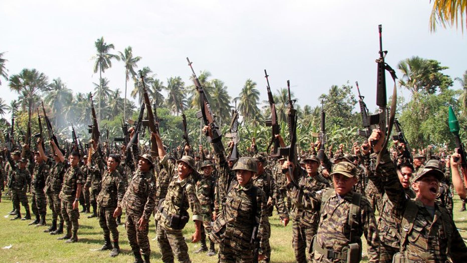 Members of the Moro Islamic Liberation Front hold a ceremony on the southern Philippine island of Mindanao on October 15, 2012. The Philippine government has resolved a key hurdle in peace talks with the Muslim rebels, it announced early Sunday, bringing it closer to ending an insurgency that has claimed tens of thousands of lives.