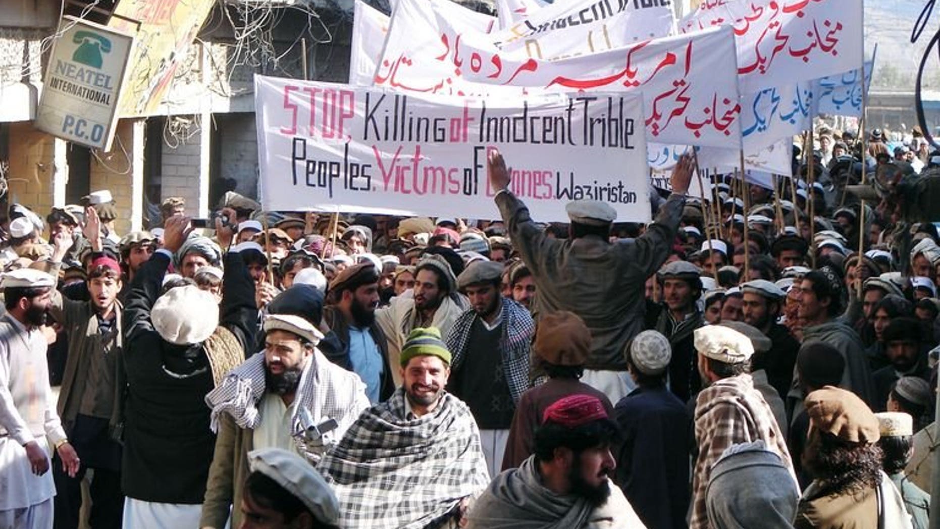 Pakistani tribesmen march in Miransha, Pakistan, during a protest rally against US drone attacks on January 21, 2011. A US drone strike in the troubled northwestern tribal belt of North Waziristan late Saturday killed two militants on a motorcycle and damaged nearby houses, officials said.