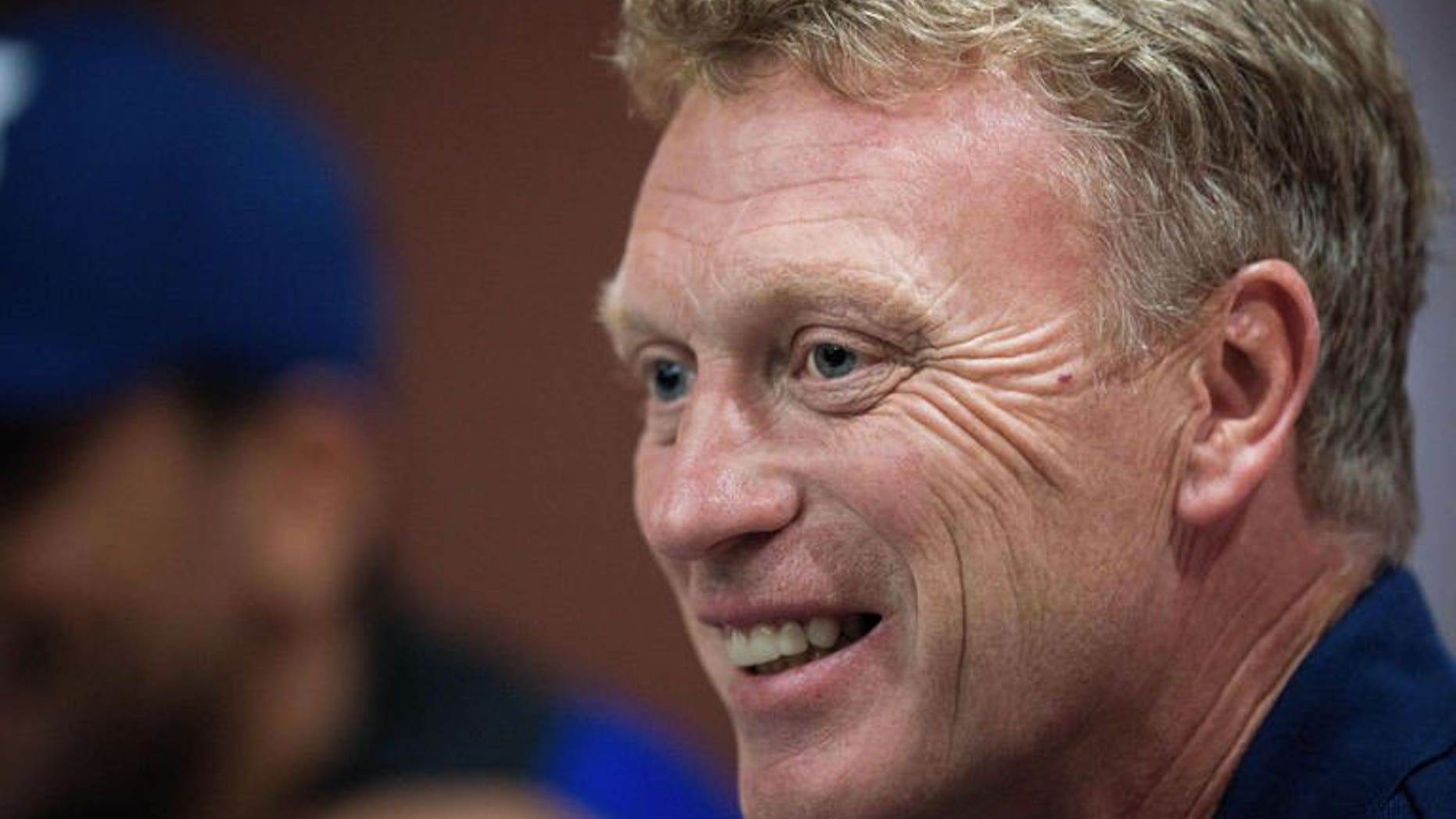 Manchester United football manager David Moyes speaks to the media in Bangkok on July 12, 2013. Moyes says he still needs to come to terms with the level of scrutiny he faces as manager of one of the world's biggest football clubs.