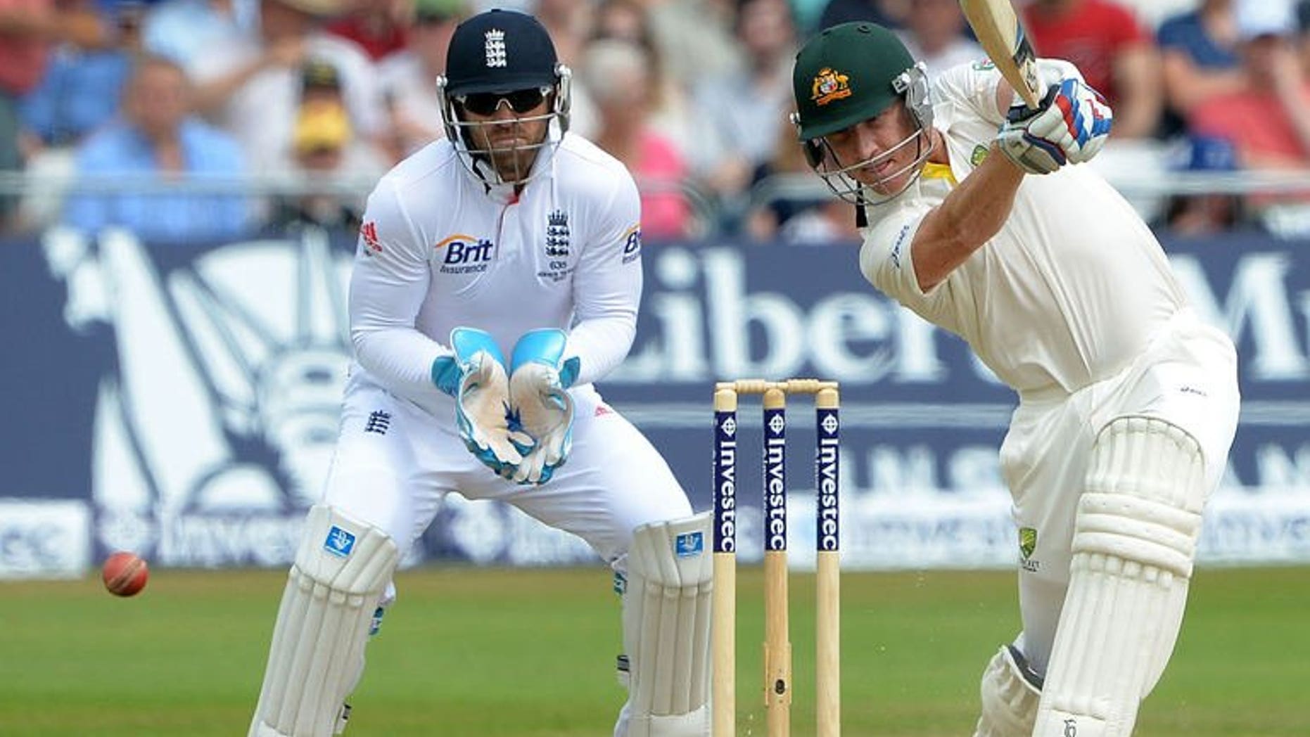 England's Matt Prior (left) watches Australia's Brad Haddin bat during the fifth day of the first Ashes cricket Test in Nottingham on July 14, 2013. Australia were 291 for nine, needing just 20 more runs to reach their victory target of 311, but with only one wicket standing.