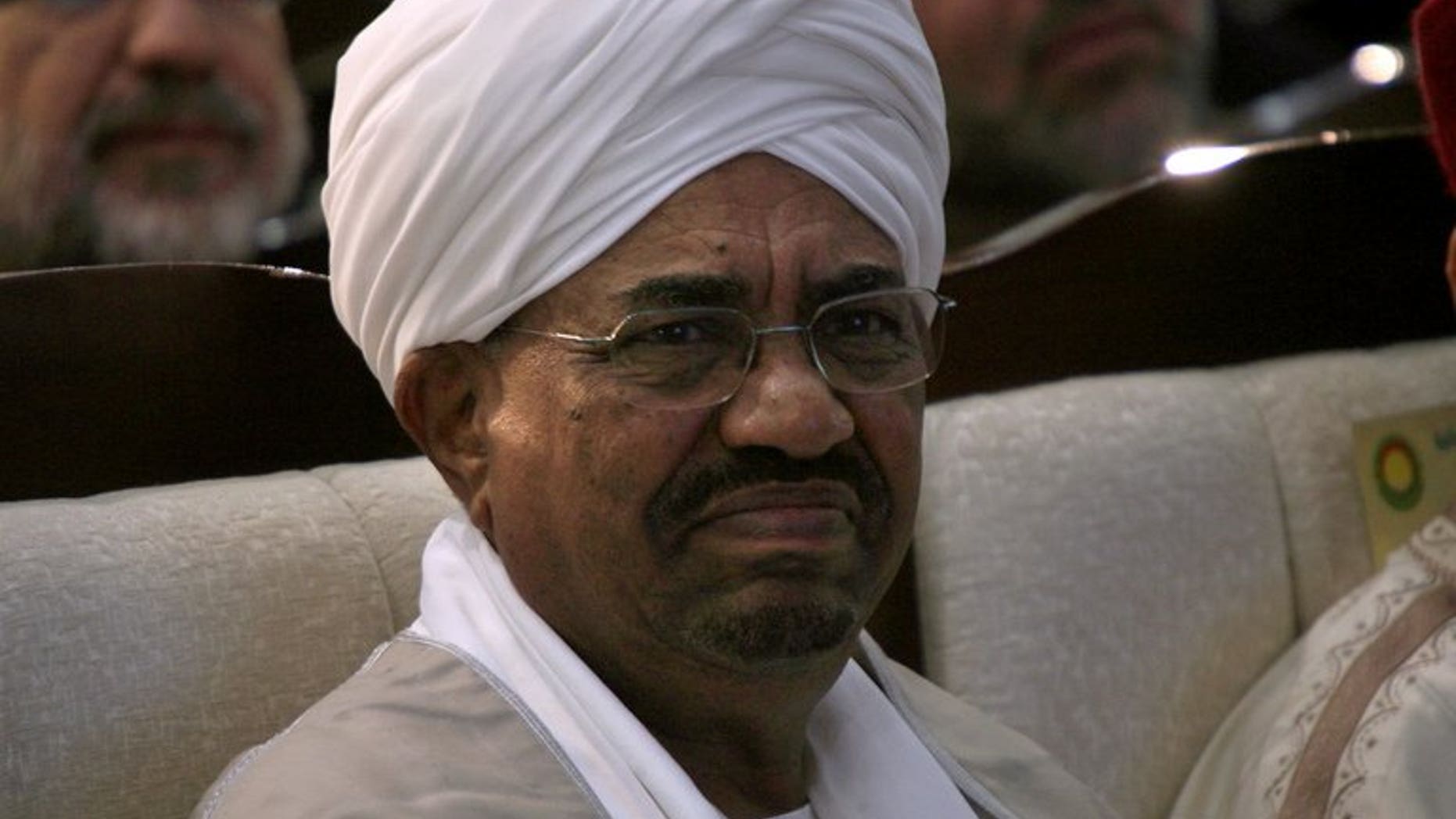Sudanese President Omar al-Bashir attends a conference of Islamists in Khartoum on November 15, 2012. Bashir travelled to a health summit in Nigeria, official media said, after Human Rights Watch urged authorities in Abuja to arrest him for war crimes charges.