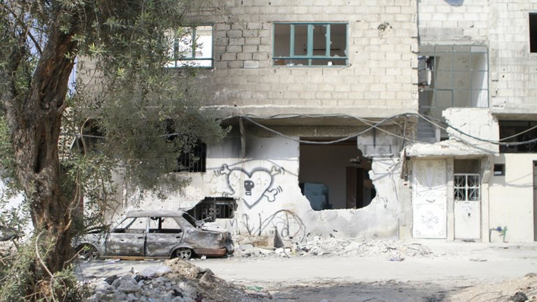 View of the destruction following fighting between rebels fighters and pro-regime forces in the Qaboun neighborhood of Damascus, on July 31,2012. Fighting between soldiers and rebels broke out on August 01,2012 for the first time near two Christian districts of Damascus, the Britain-based Syrian Observatory for Human Rights said. AFP PHOTO/IBRAHIM AL-DIMASHKI