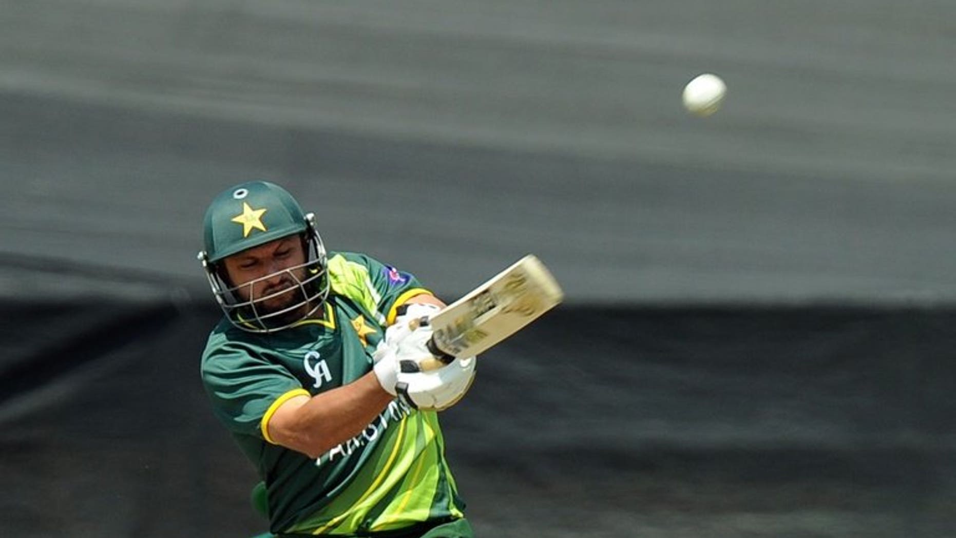 Pakistan's cricketer Shahid Afridi hits the ball in Benoni at Willowmoore Park on March 24, 2013. Hugely contrasting half-centuries by Afridi and Misbah-ul-Haq rescued Pakistan from a perilous position as they reached 224 for nine against the West Indies in the first one-day international.