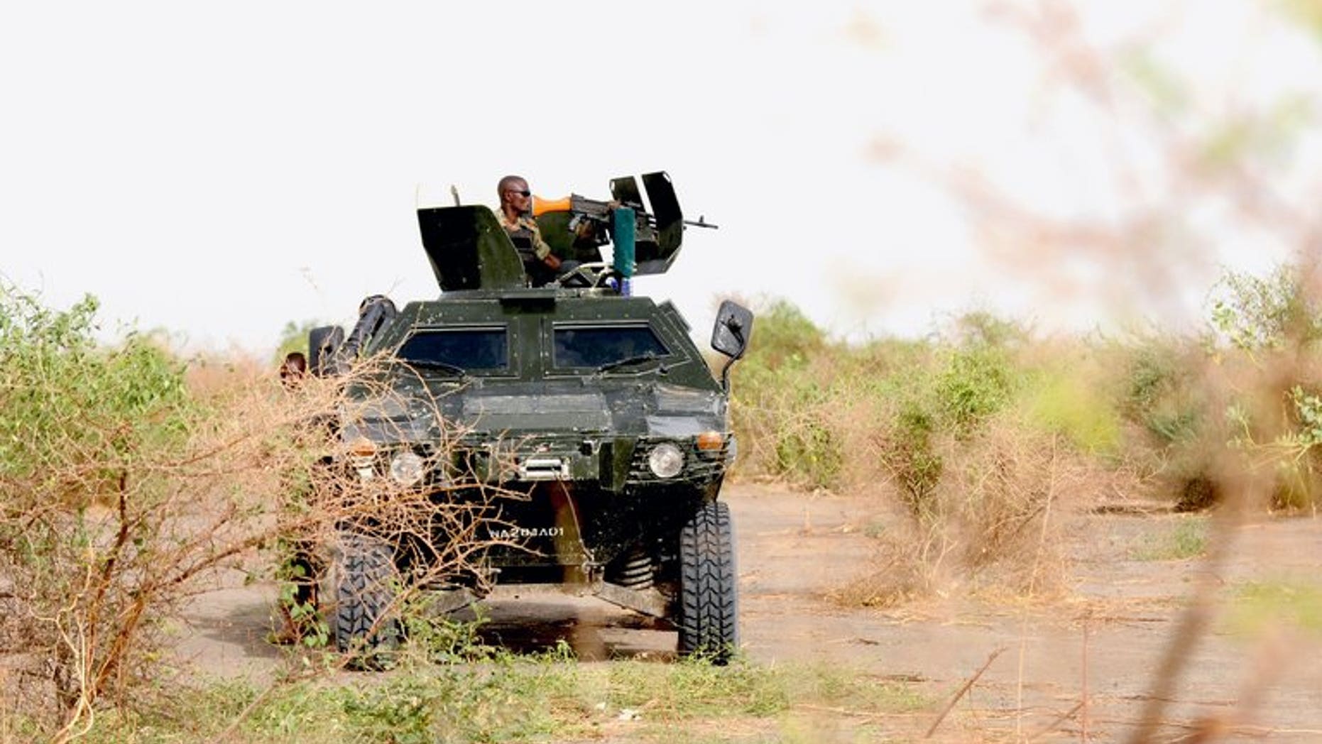 Nigerian soldiers patrol in the north of Borno state close to a former camp of the Islamist extremist group Boko Haram, on June 5, 2013 near Maiduguri. Nigeria's military on Sunday claimed the rescue of women and children hostages from a Boko Haram Islamist stronghold, saying troops killed several insurgents during recent gun battles in the area.