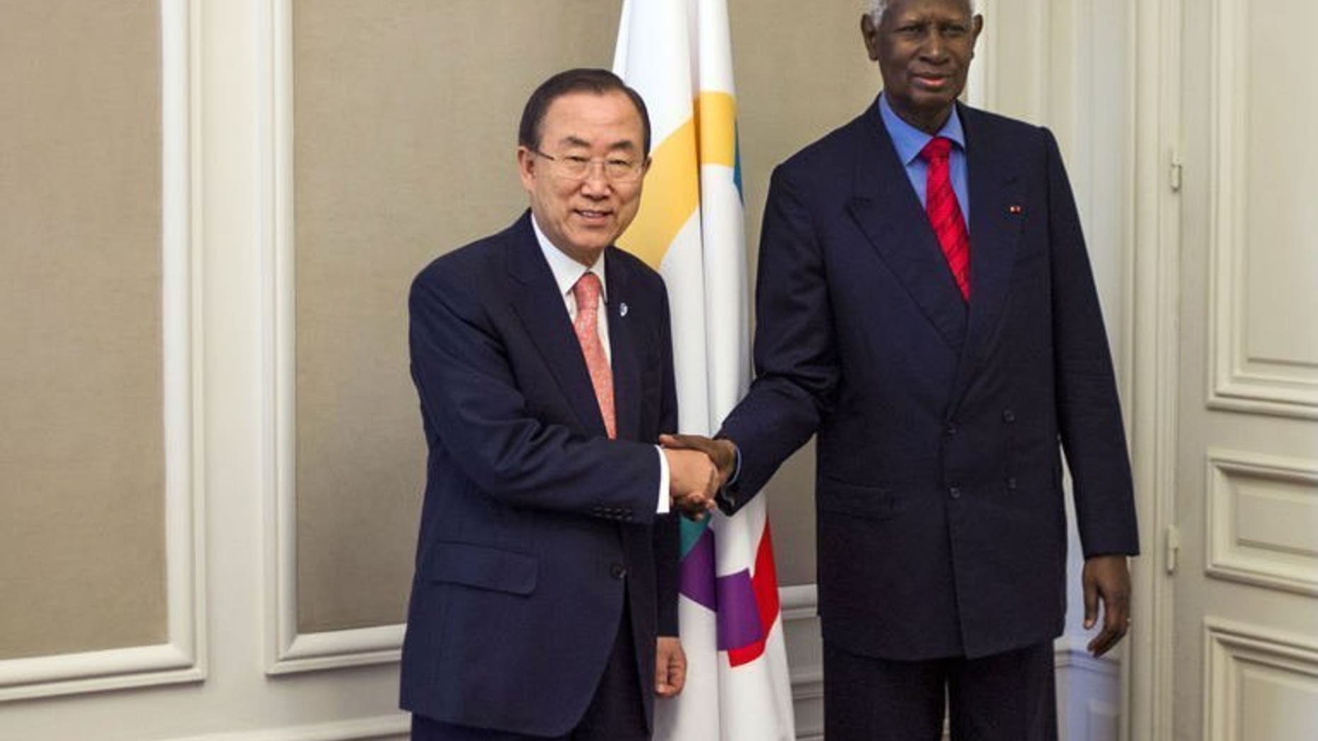 United Nations Secretary General Ban Ki-Moon (L) shakes hand with secretary general of the International Organisation of La Francophonie (OIF) Abdou Diouf in Paris on July 15, 2013. Ban on Monday called for the results of Mali's upcoming election to be respected even if the vote is "imperfect", amid scepticism about the country's ability to stage the poll.