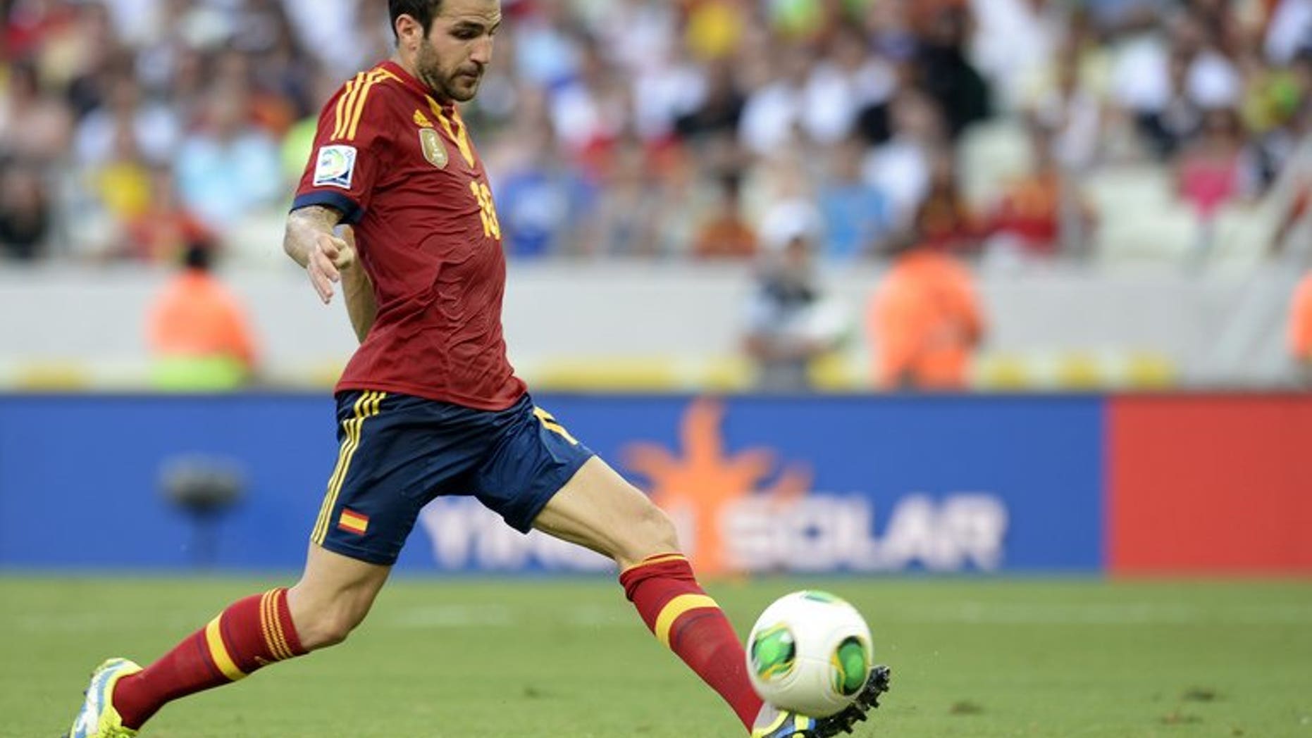 Spain's midfielder Cesc Fabregas drives the ball during a FIFA Confederations Cup Brazil 2013 match against Nigeria at the Castelao Stadium in Fortaleza on June 23, 2013. Manchester United have made a ??25 million ($37.7 million, 28.9-million-euros) offer for Fabregas, reports in the media suggested.