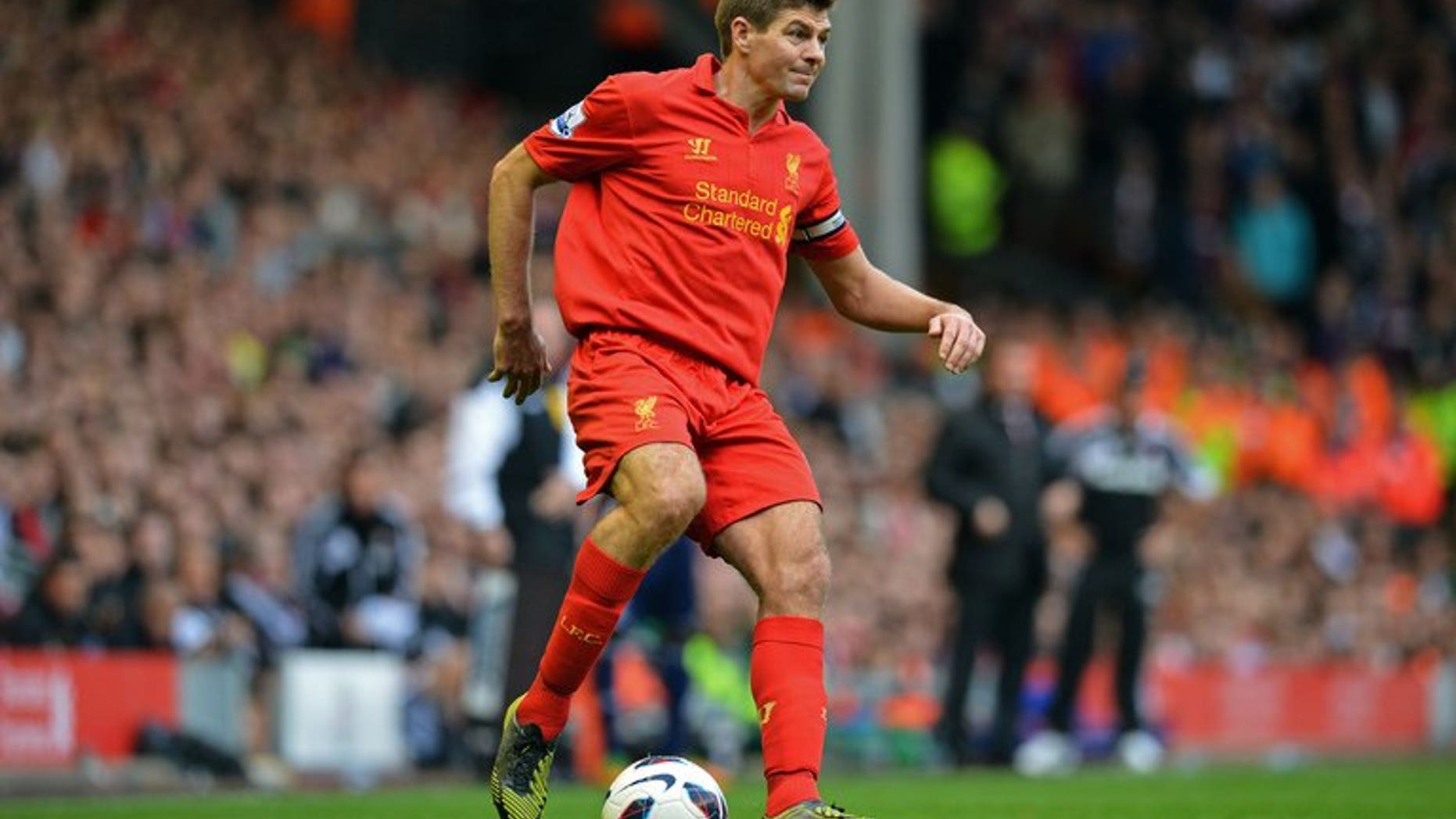 Liverpool midfielder Steven Gerrard controls the ball during a Premier League match against Stoke City at Anfield in Liverpool on October 7, 2012. Gerrard signed a new two-year contract extension with the only club he has ever played for.
