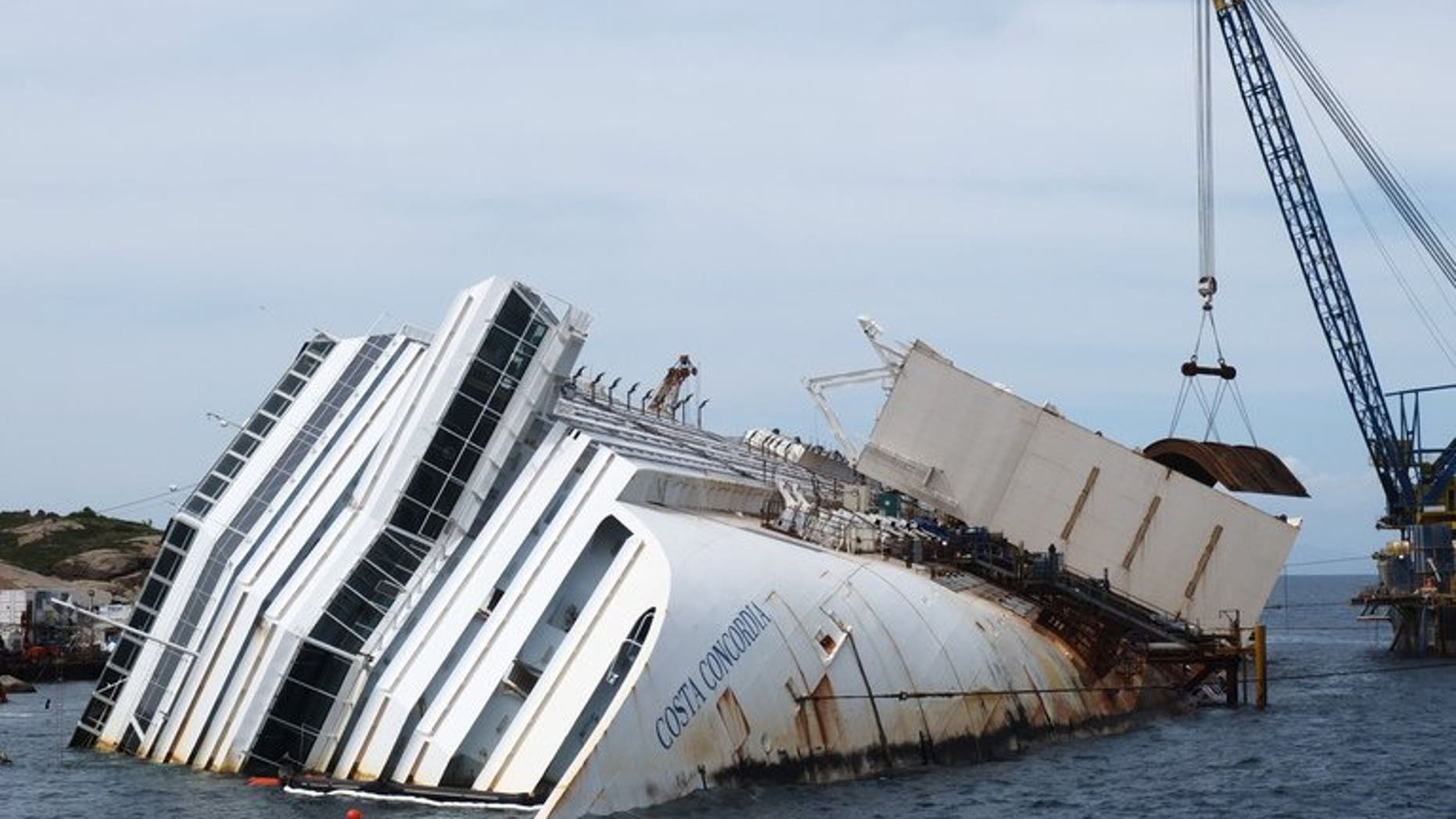 As the trial against the captain of Italy's Costa Concordia gets under way, the mayor of the island where the ship lies said he was increasingly concerned about its salvage.