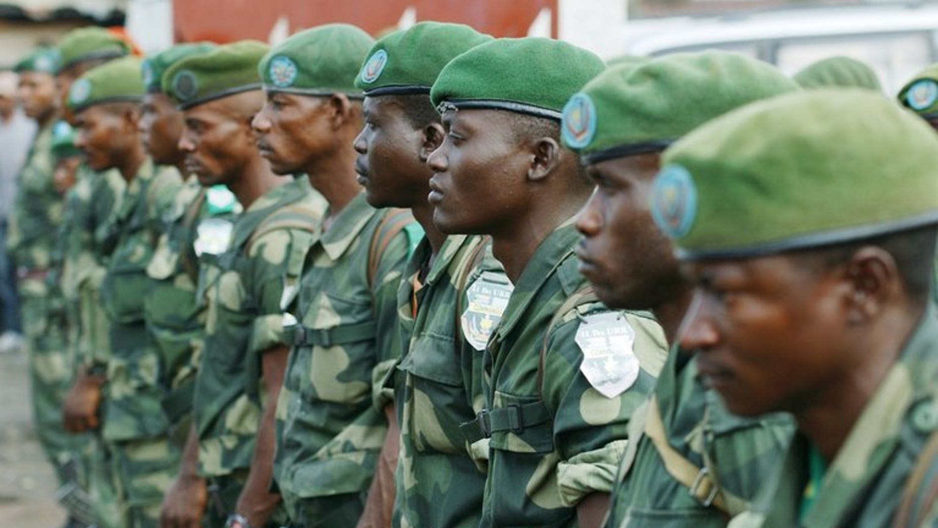 DR Congo's national army FARDC soldiers stand in formation in Karisimbi, south of Goma, on May 27, 2013. Rwanda's military spokesman said two mortar bombs were fired into the country from neighbouring DR Congo on Monday, blaming the DRC army - the FARDC - and the UN force MONUSCO.