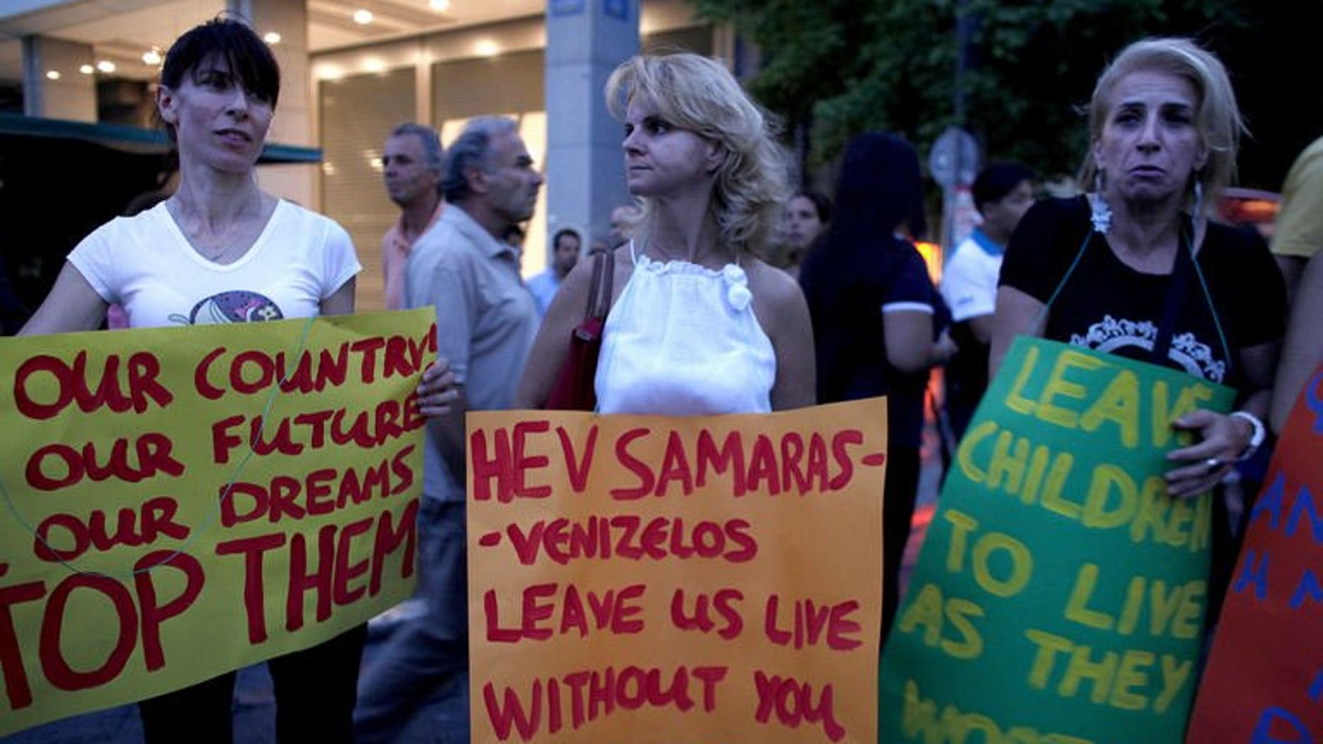 Greeks demonstrate against government economic austerity measures on July 15, 2013 in Athens.