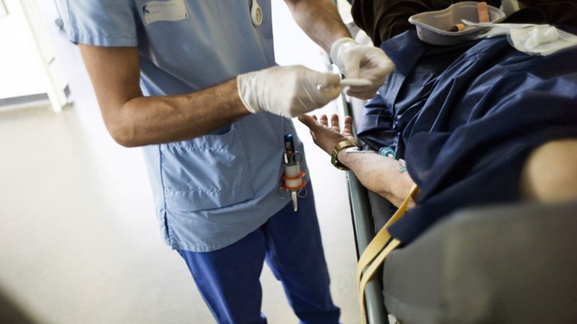 A doctor tends to a patient at a hospital in Paris, on May 31, 2013. Health bosses are expected to come under fire following a review of 14 hospitals with the worst mortality rates in England.