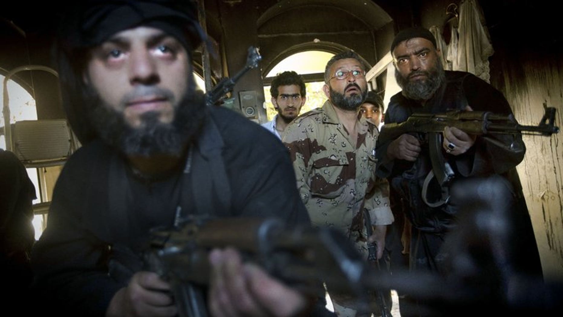 Syrian rebels take position during clashes with regime forces in Aleppo, on May 22, 2013. Iran says it would welcome ceasefire between rebel forces and the Syrian government during the Muslim holy month of Ramadan, reiterating that a national dialogue was the only way to resolve the crisis.