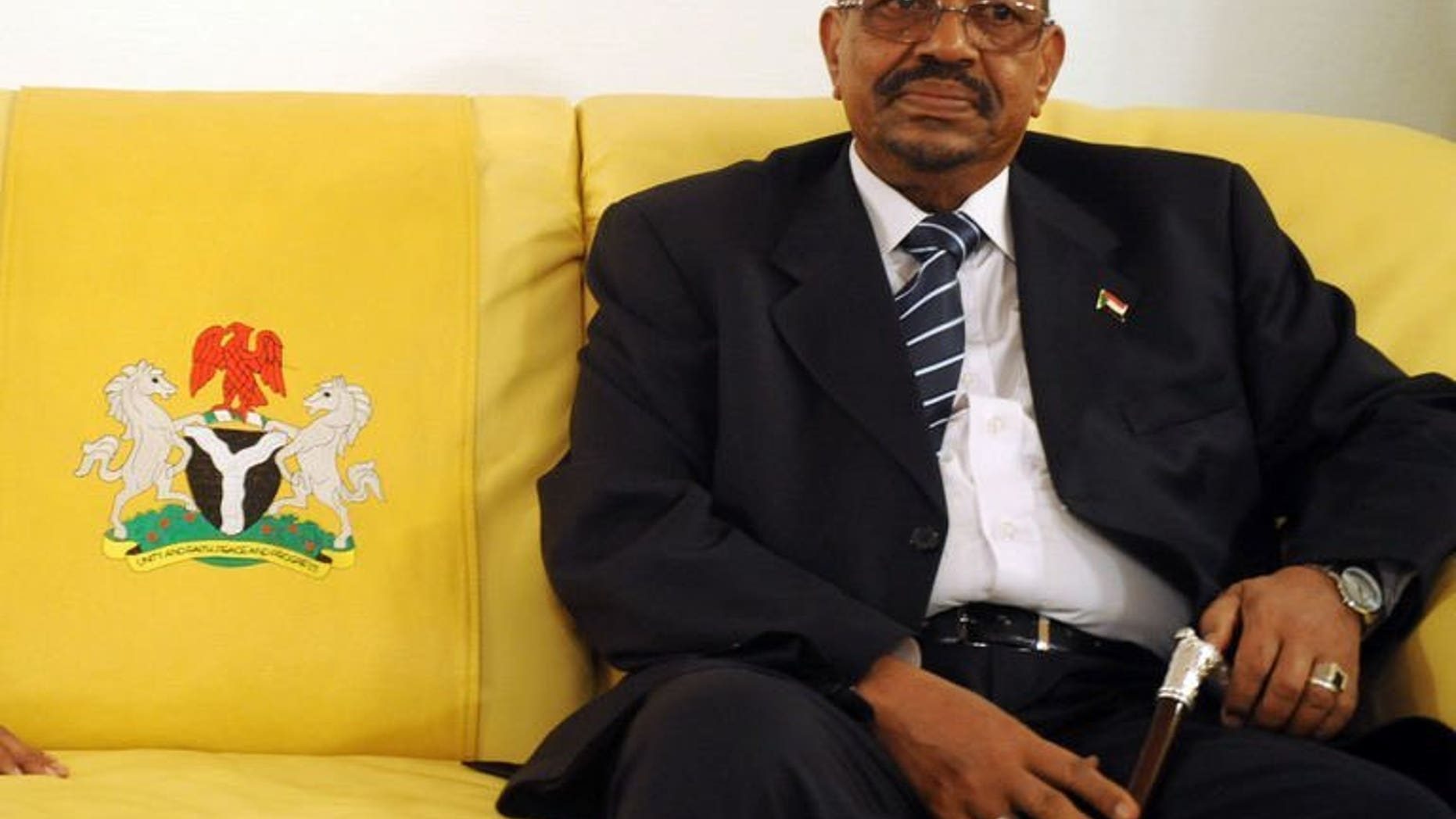 Sudan's President Omar al-Bashir pictured at Nnamdi Azikiwe International Airport in Abuja, Nigeria on July 14, 2013. Bashir has left Nigeria after demands for his arrest on war crimes charges, an embassy spokesman said Tuesday, though he denied his departure was due to the controversy.