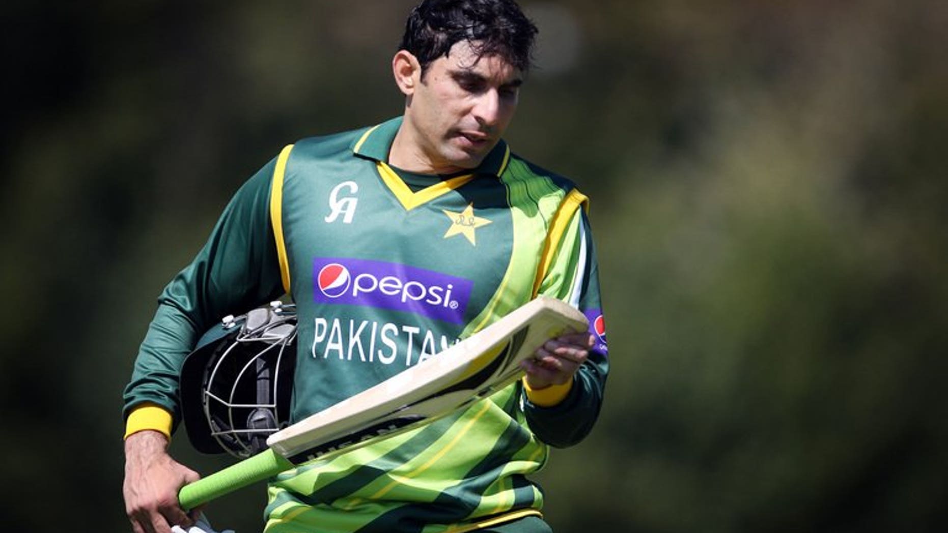 Pakistan's Misbah-ul-Haq looks at his bat during a one-day international in Edinburgh, on May 17, 2013. Misbah-ul-Haq has won the toss and put West Indies in to bat in the second one-day international of their five-match series at the Guyana National Stadium.