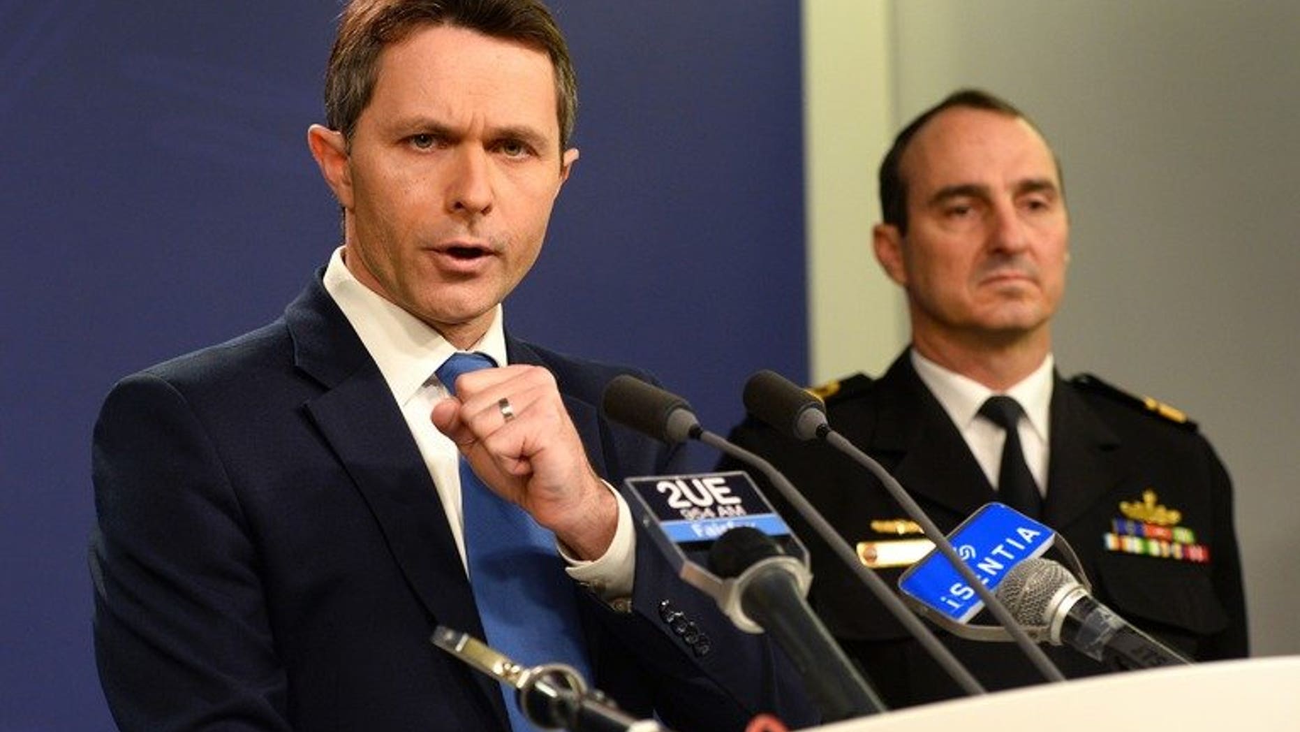 Australian Home Affairs Minister Jason Clare (L) and Commander of Border Protection Command, Rear Admiral David Johnston, during a press conference in Sydney on July 17, 2013. Asylum-seekers drowning on the treacherous boat journey to Australia presented a "god-awful" problem, Clare said.